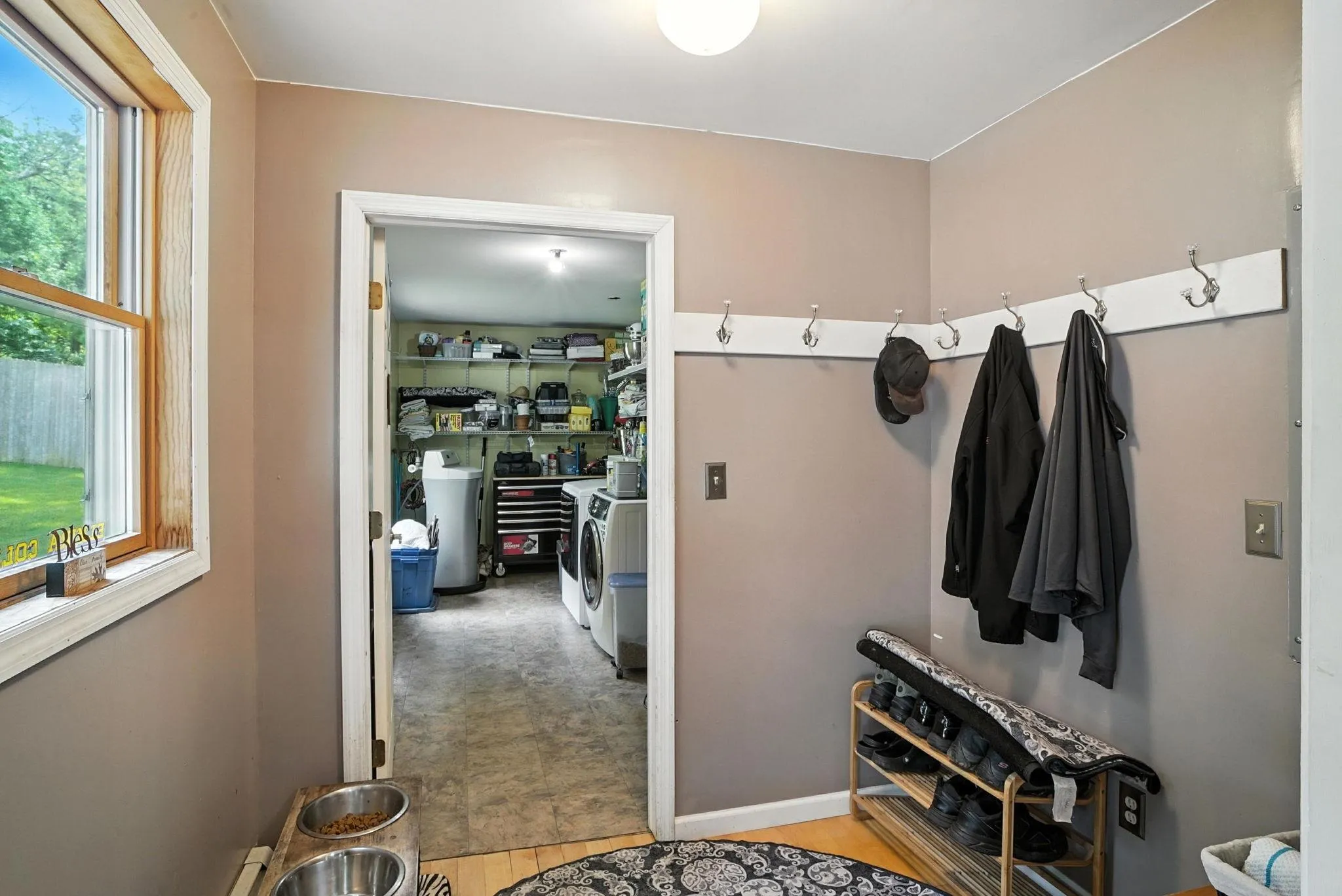 Mudroom with washer and clothes dryer and baseboards Mudroom with washer and clothes dryer and baseboards