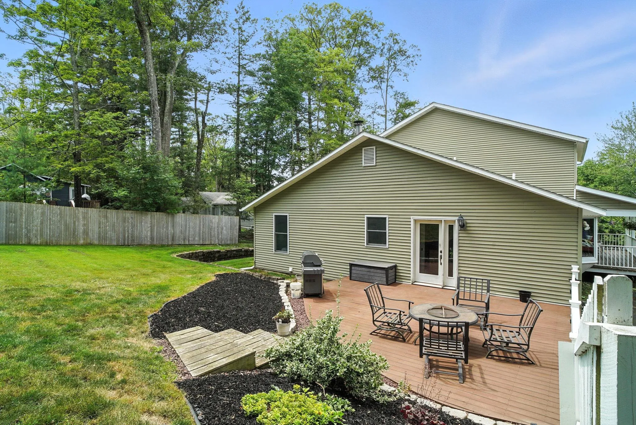 Side of home with a patio leading into the kitchen or yard Side of home with a patio leading into the kitchen or yard