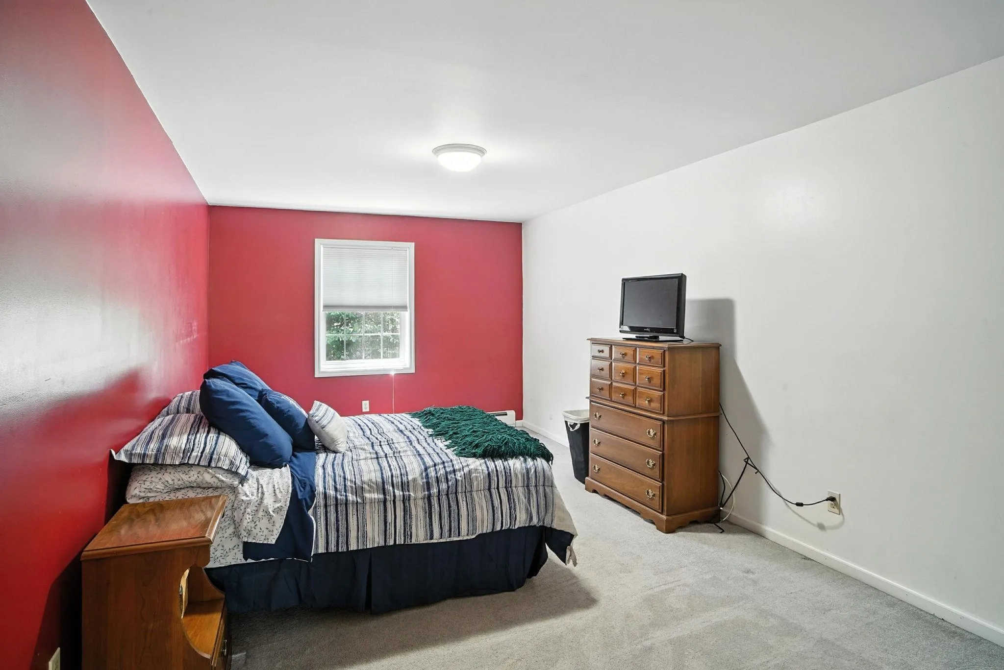 Carpeted bedroom with baseboards Carpeted bedroom with baseboards