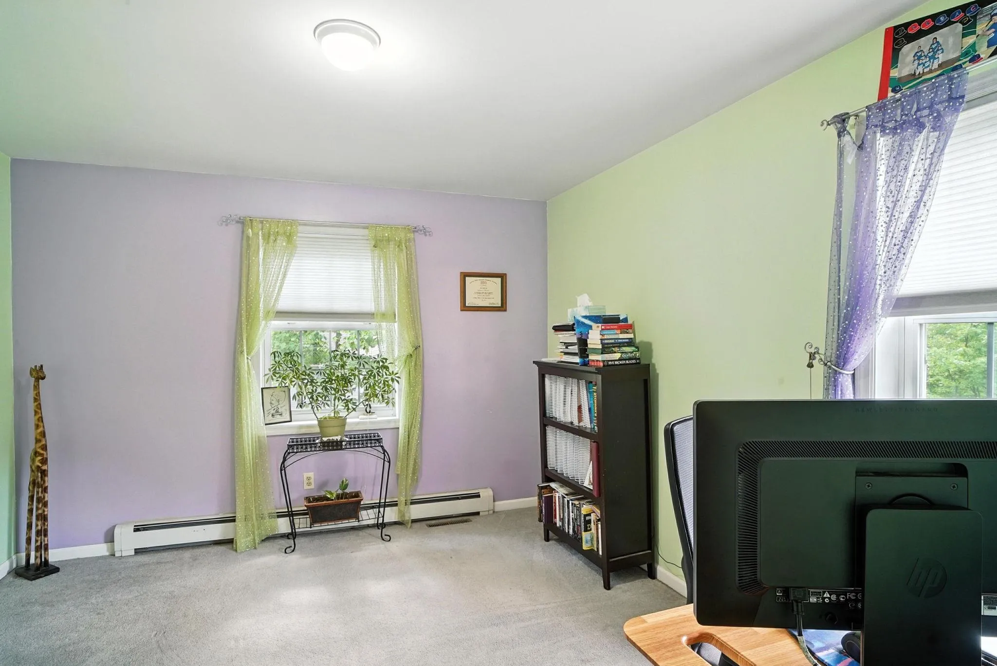 Carpeted office featuring healthy amount of natural light and baseboard heating Carpeted office featuring healthy amount of natural light and baseboard heating