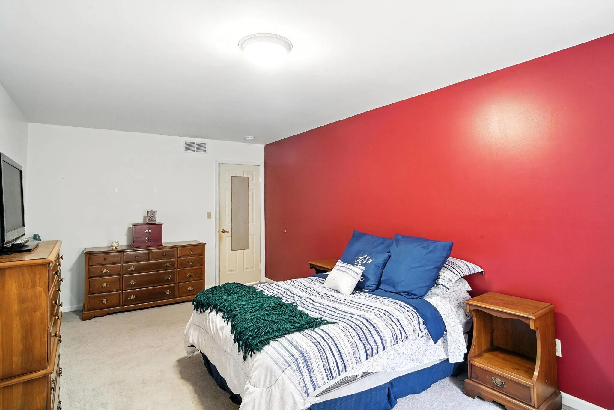 Bedroom featuring carpet flooring and baseboards Bedroom featuring carpet flooring and baseboards