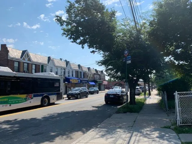 View of asphalt road with sidewalks and a residential view View of asphalt road with sidewalks and a residential view