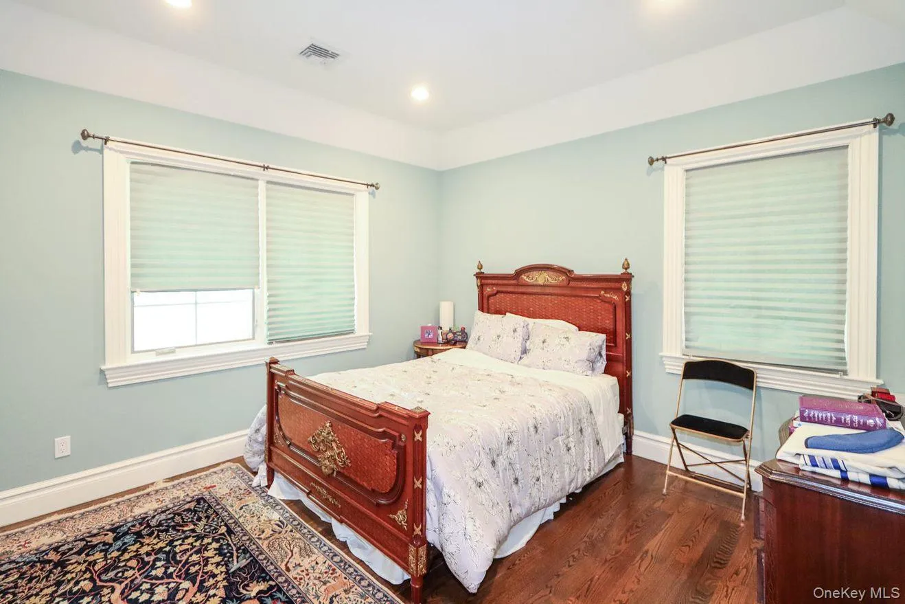Bedroom featuring wood finished floors and recessed lighting Bedroom featuring wood finished floors and recessed lighting