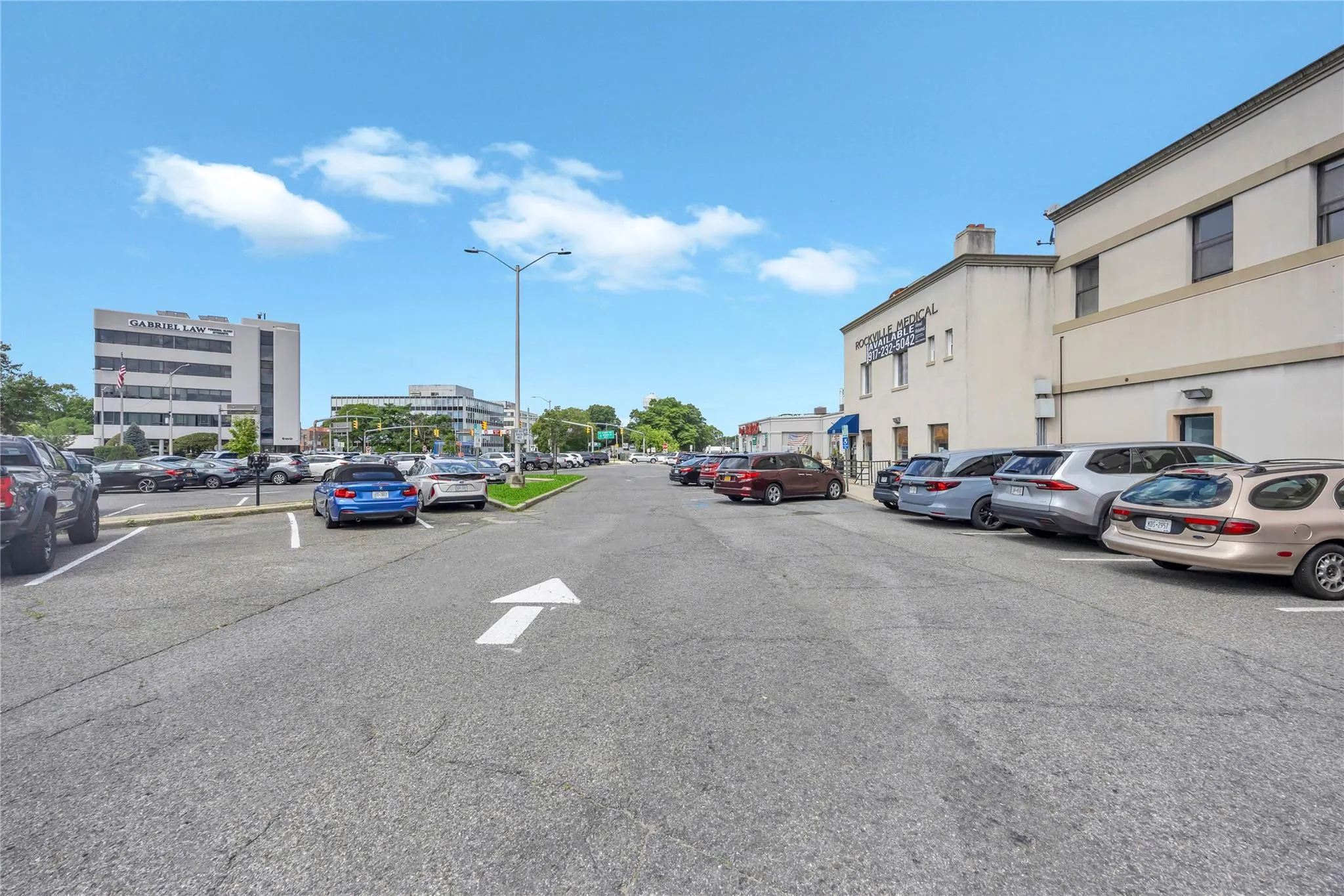 View of asphalt street featuring street lighting View of asphalt street featuring street lighting