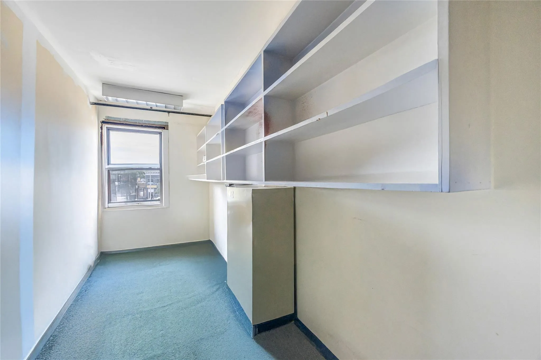 Spacious closet with carpet floors Spacious closet with carpet floors
