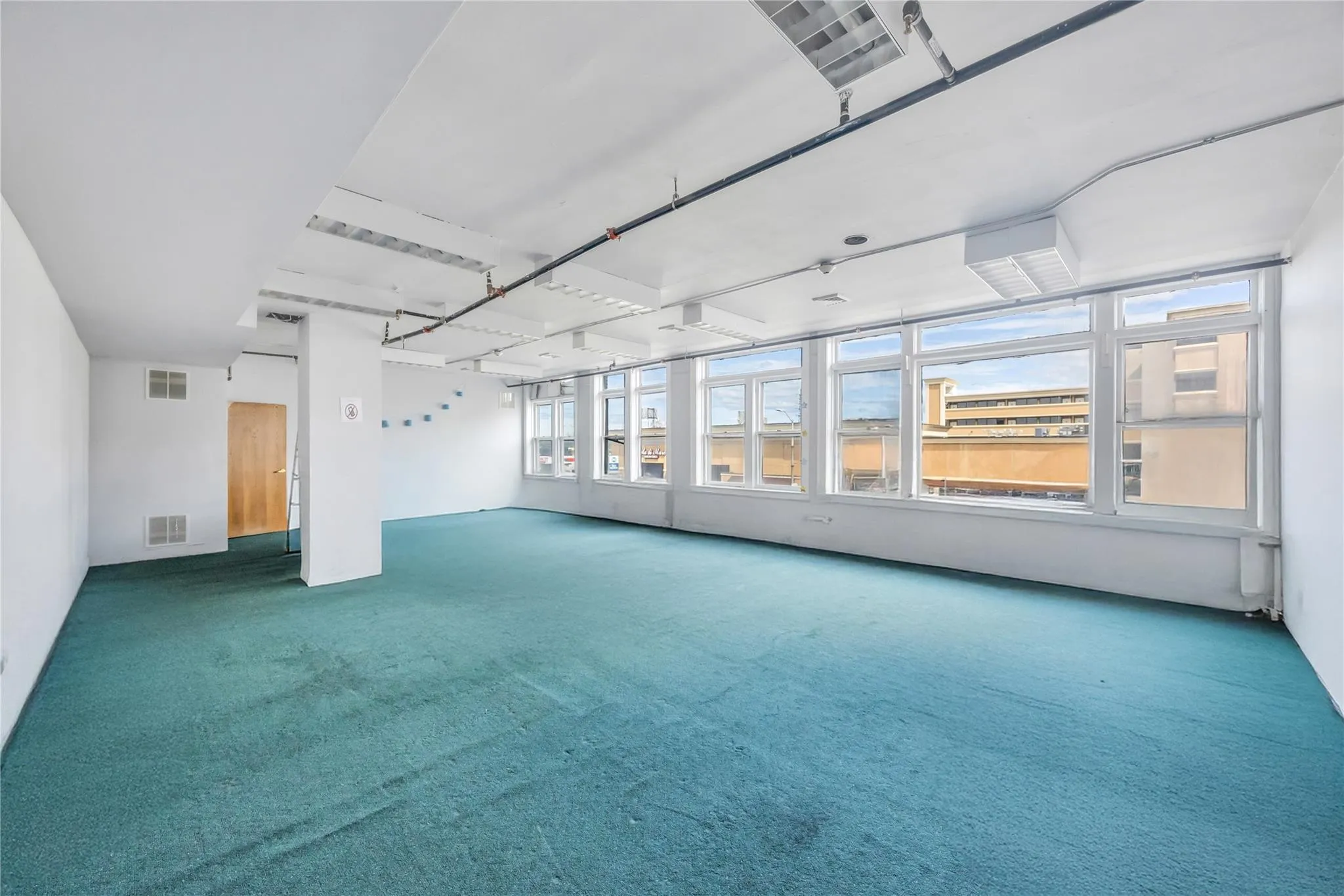 Unfurnished room with carpet floors Unfurnished room with carpet floors
