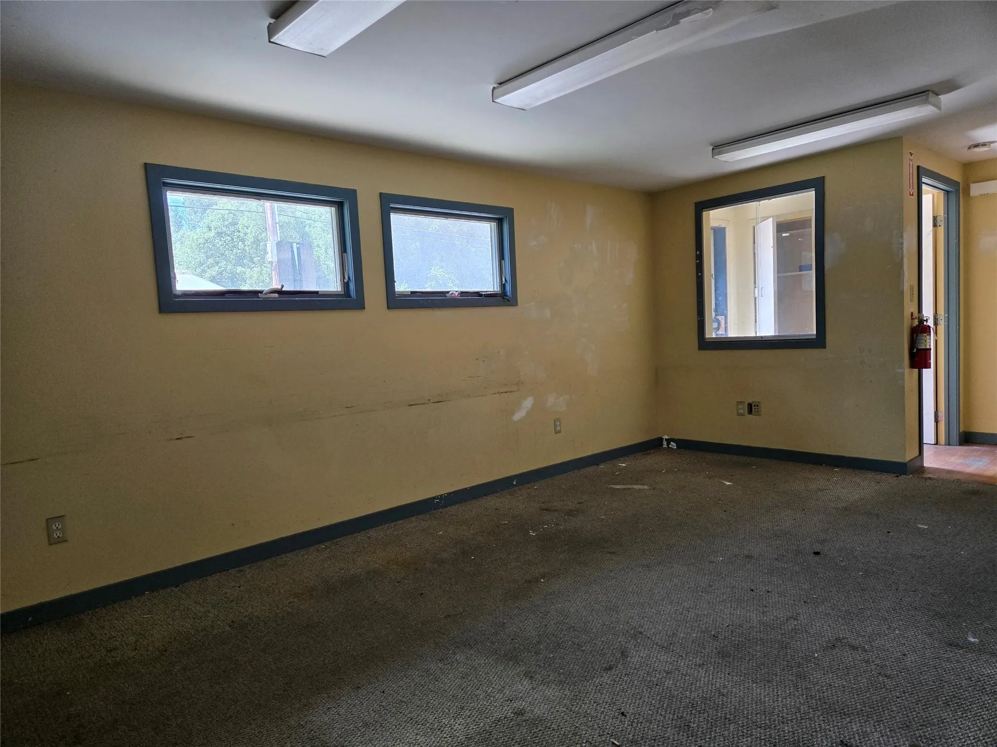 Empty room featuring baseboards and carpet Empty room featuring baseboards and carpet