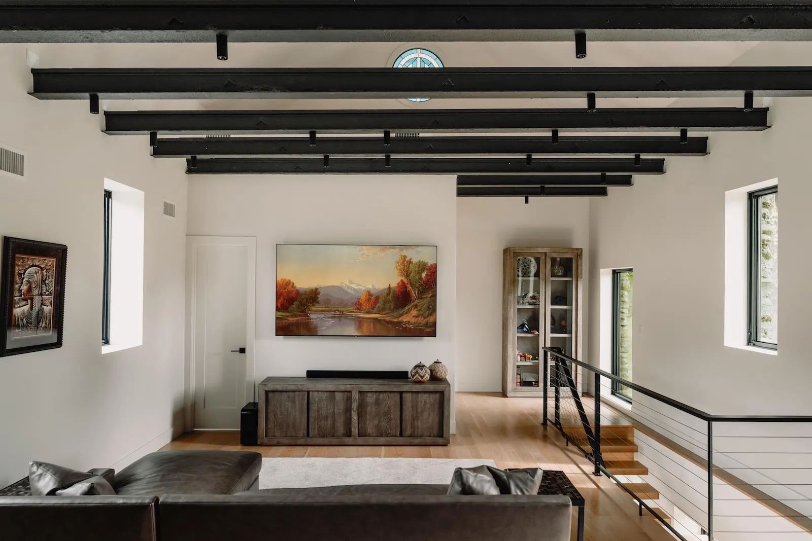 Living room with wood finished floors and beamed ceiling Living room with wood finished floors and beamed ceiling