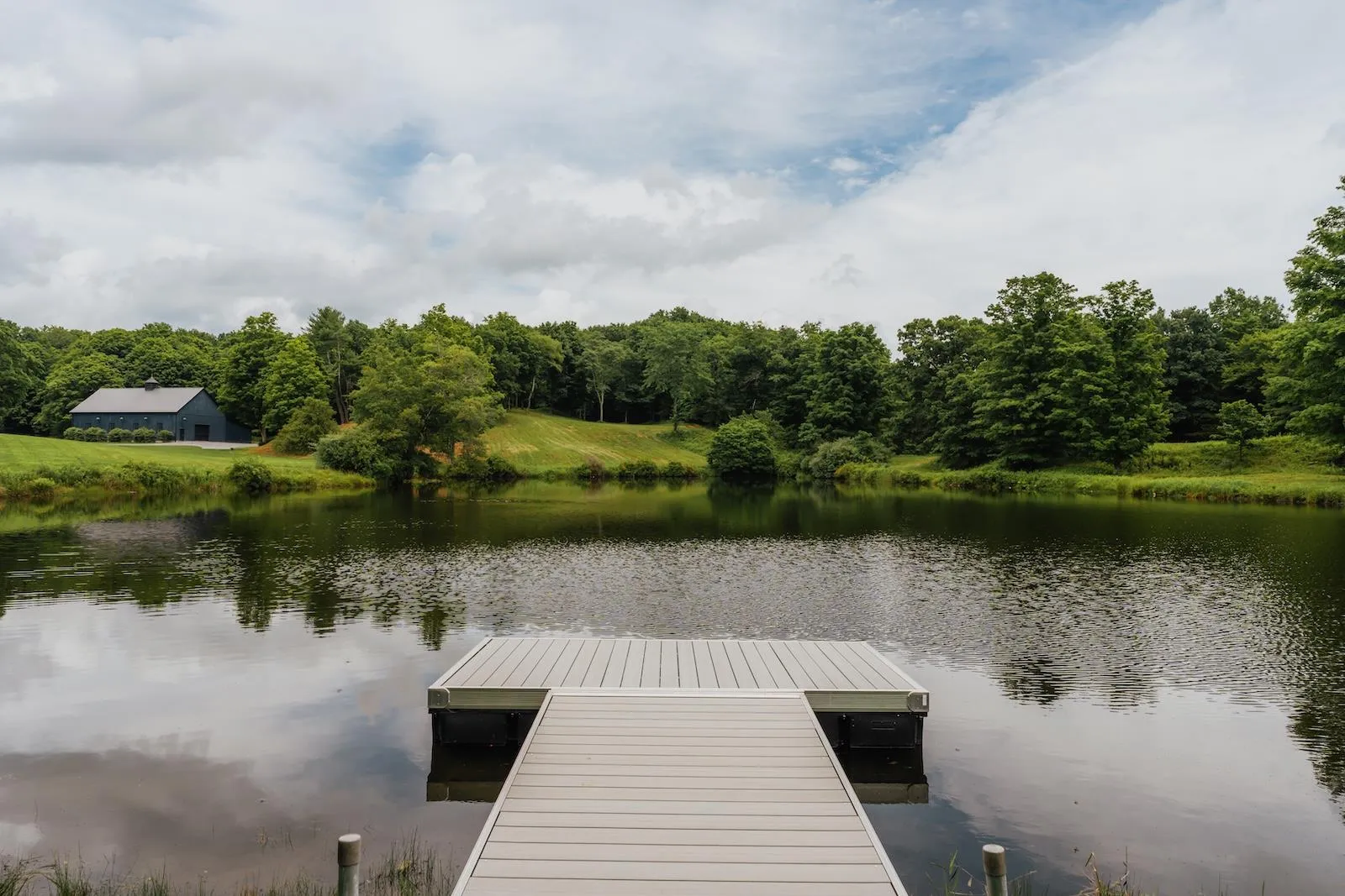Dock area with a water view and a view of trees Dock area with a water view and a view of trees