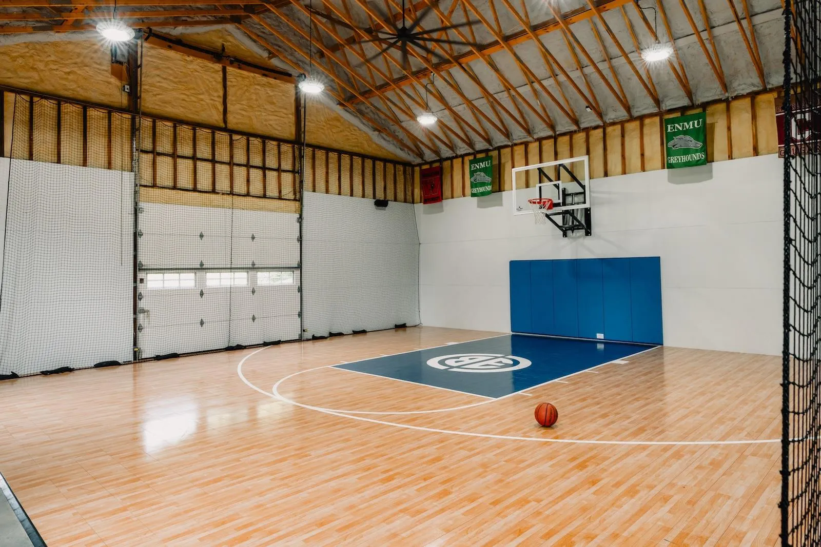 View of basketball court with basketball hoop and plenty of natural light View of basketball court with basketball hoop and plenty of natural light