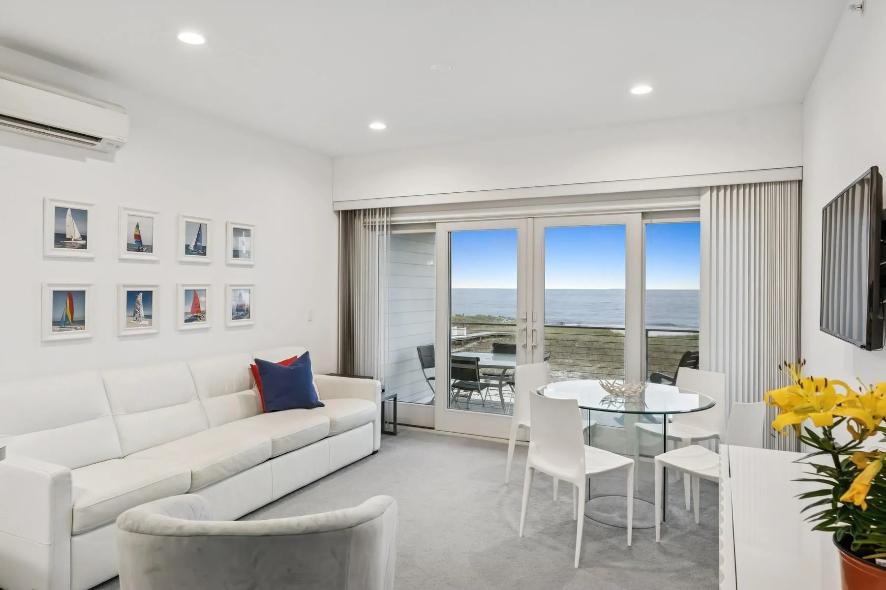 Bright and open living space with ocean and beach views. Bright and open living space with ocean and beach views.