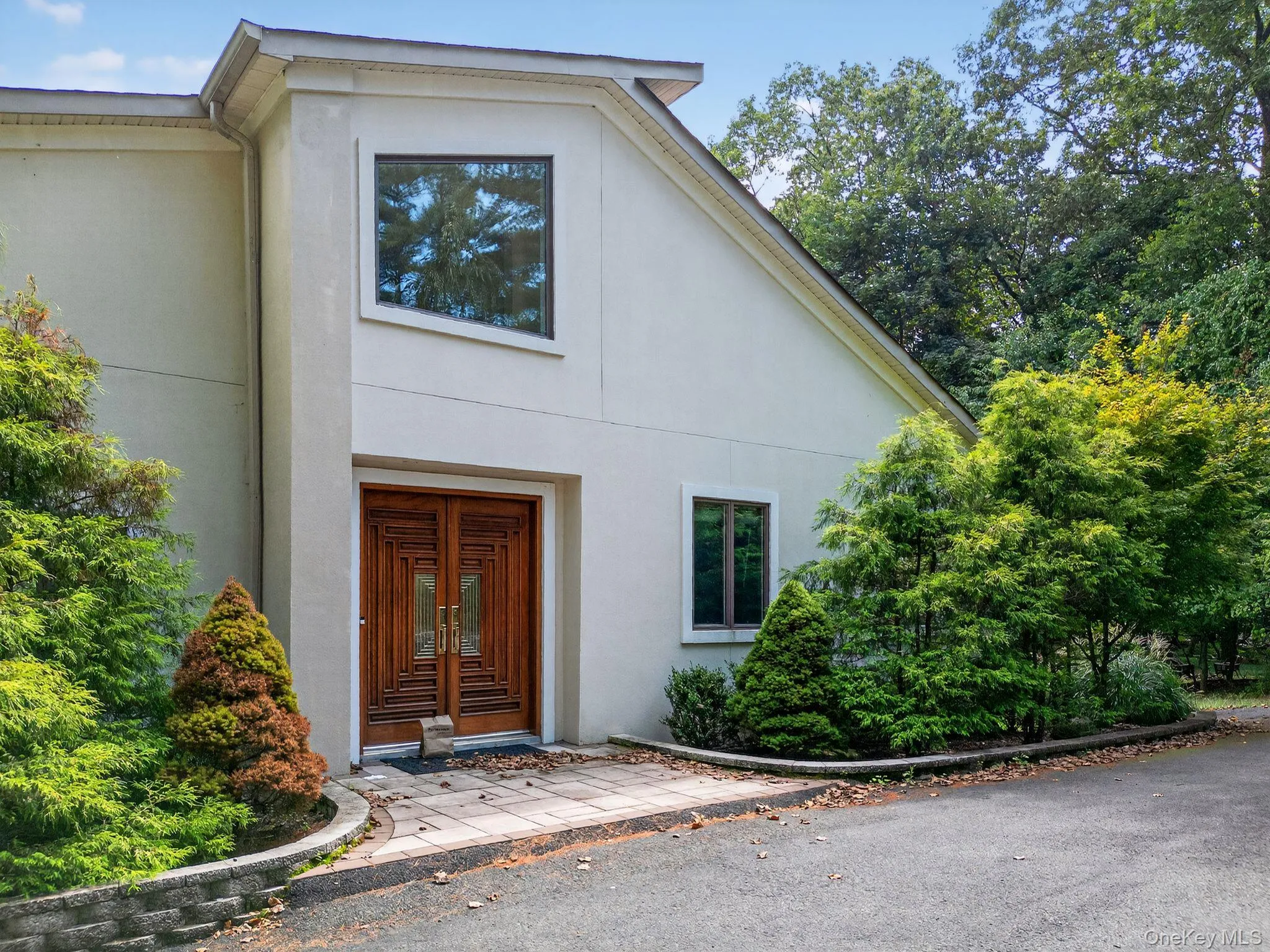 Property entrance with stucco siding Property entrance with stucco siding