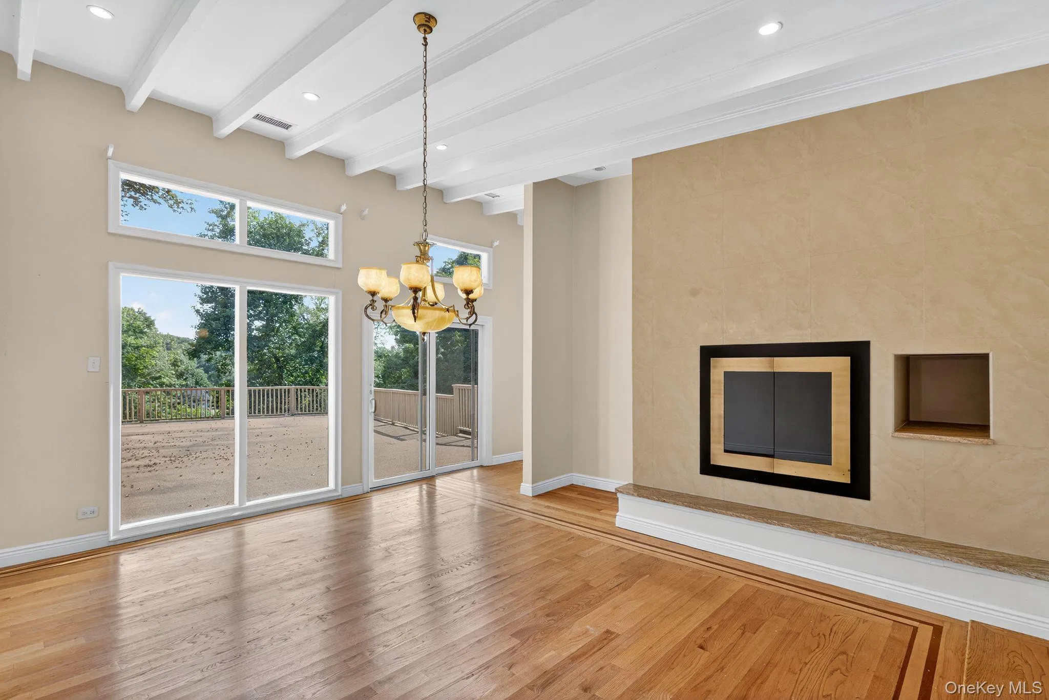 Unfurnished dining area with light wood-style flooring, beam ceiling, a chandelier, and recessed lighting Unfurnished dining area with light wood-style flooring, beam ceiling, a chandelier, and recessed lighting