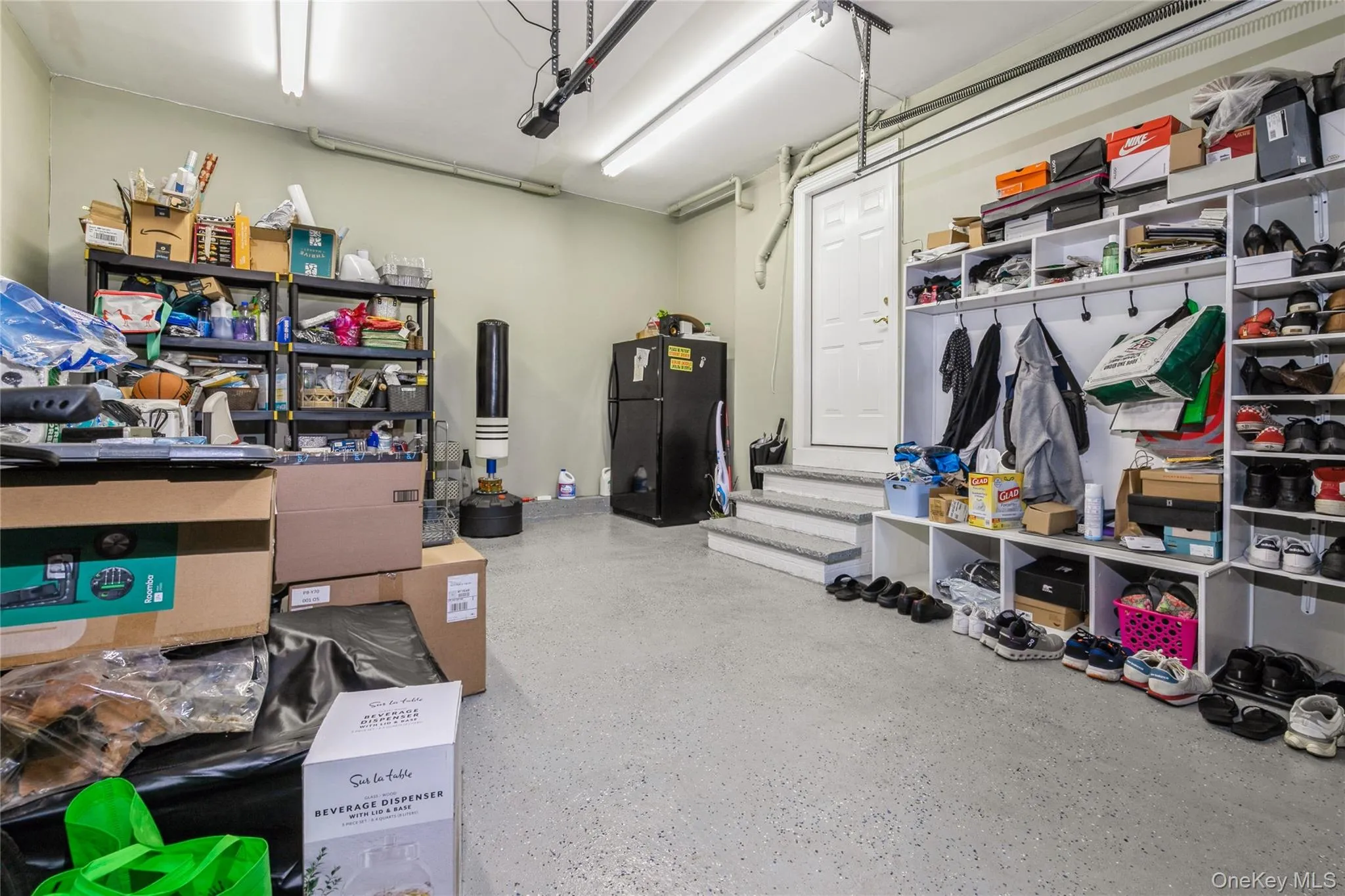 Garage with freestanding refrigerator Garage with freestanding refrigerator