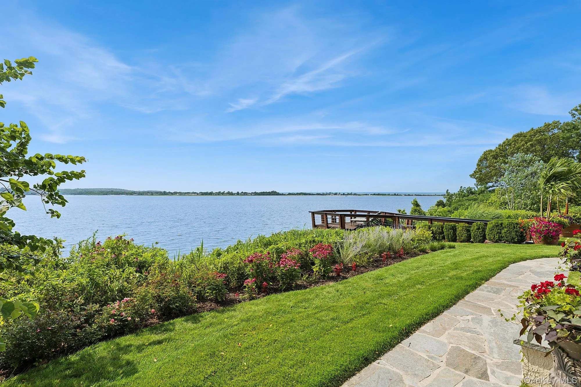 View of green lawn with a water view View of green lawn with a water view