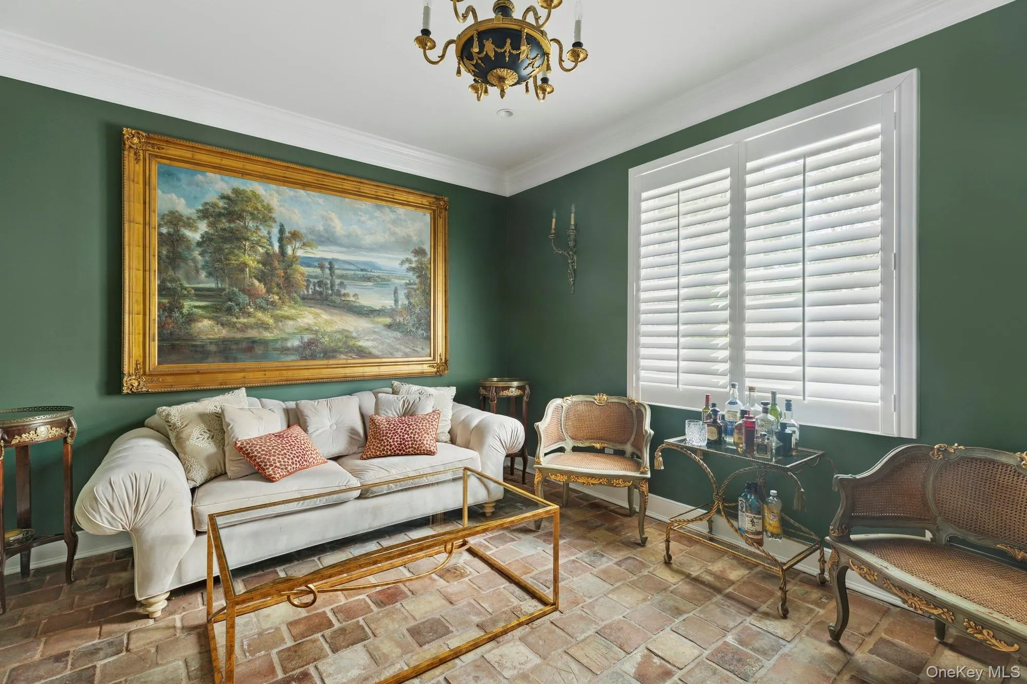 Sitting room with crown molding, brick flooring, and a chandelier Sitting room with crown molding, brick flooring, and a chandelier