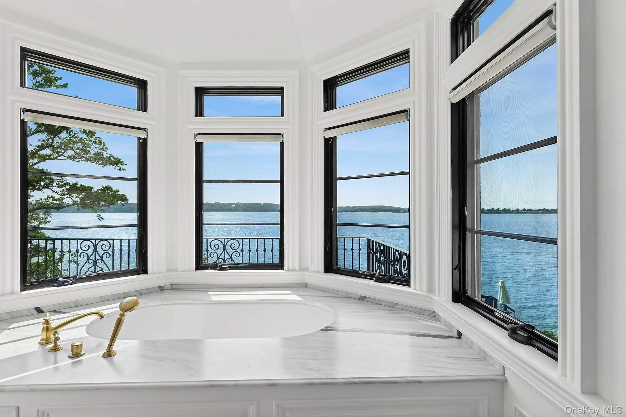Bathroom with a water view Bathroom with a water view