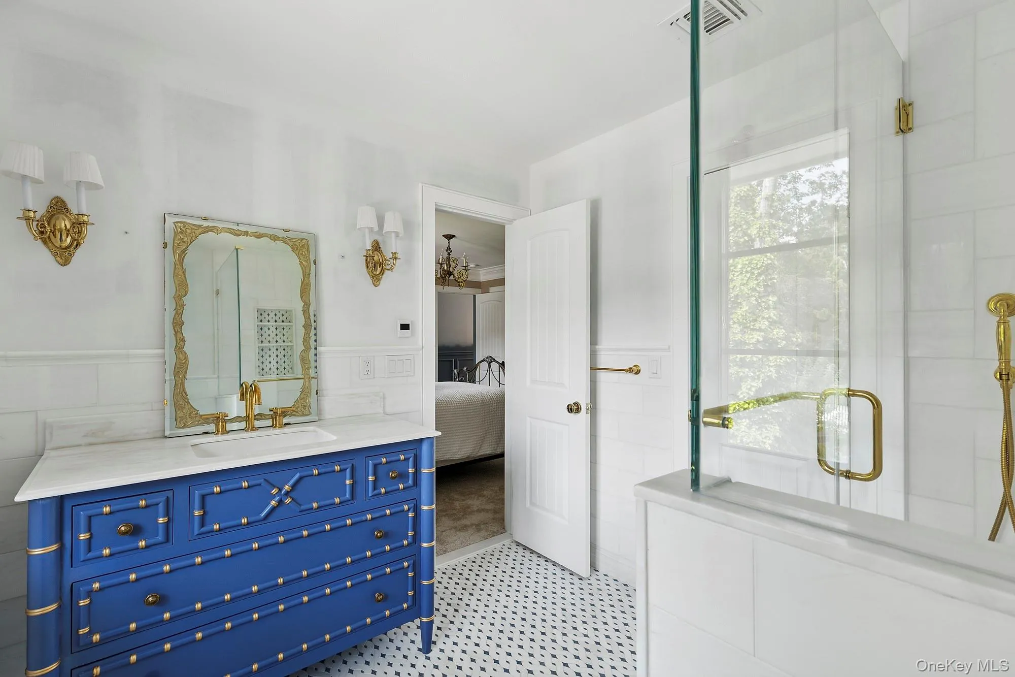 Ensuite bathroom with a shower stall, vanity, a wainscoted wall, and tile walls Ensuite bathroom with a shower stall, vanity, a wainscoted wall, and tile walls