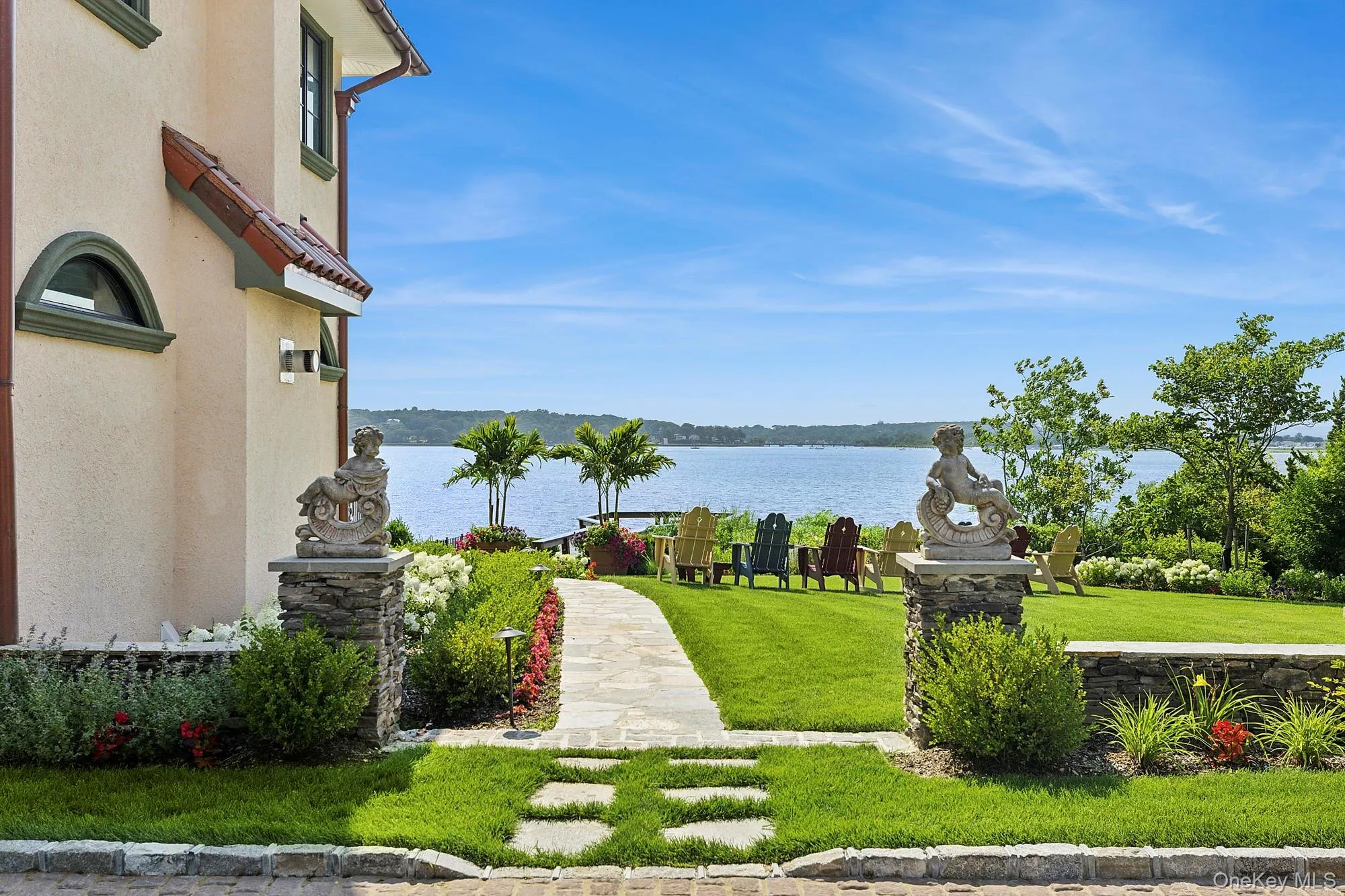 View of community featuring a water view and a lawn View of community featuring a water view and a lawn