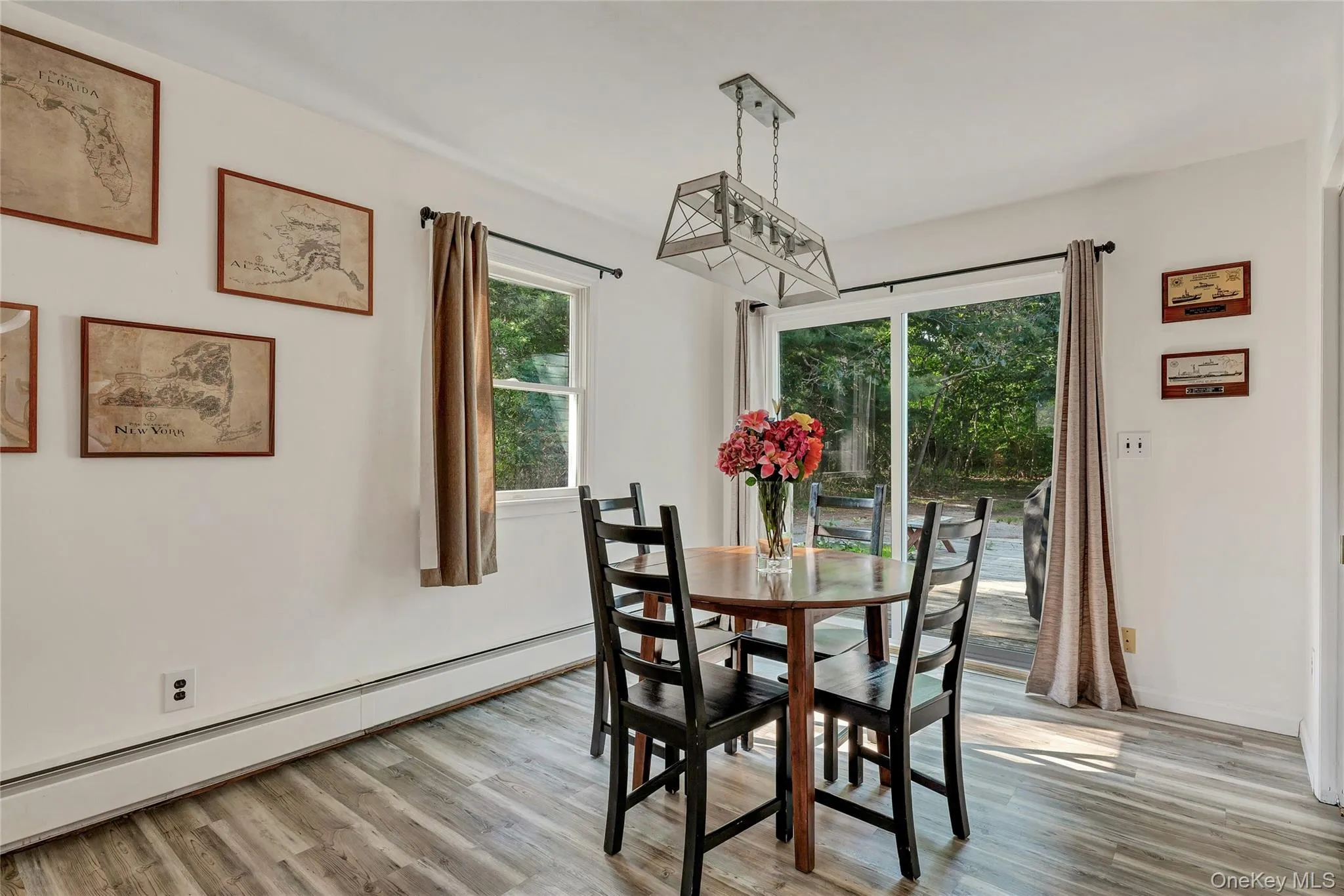 Dining Room with new sliders to the back deck and yard. Dining Room with new sliders to the back deck and yard.