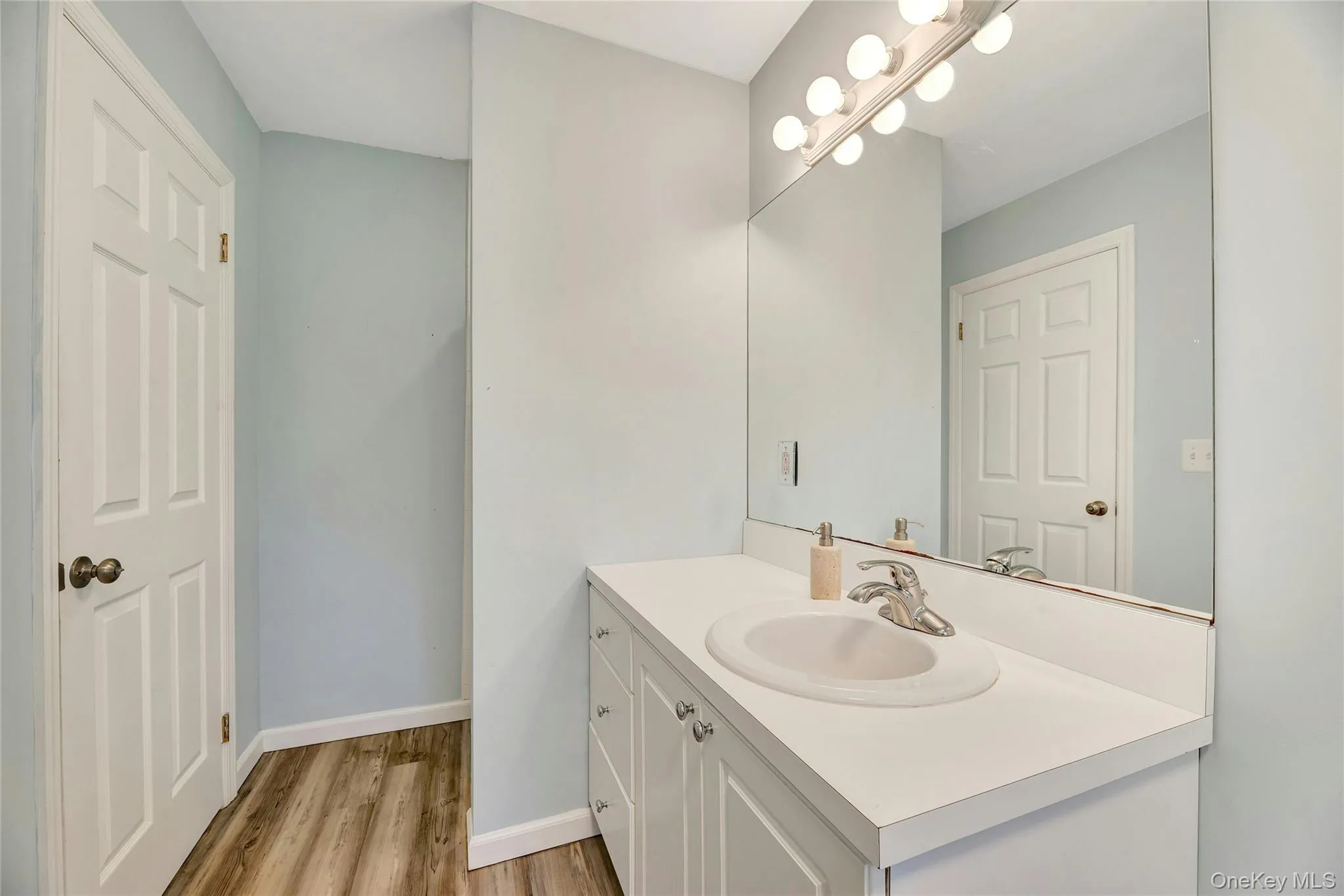Primary Bedroom Bathroom featuring large vanity. Primary Bedroom Bathroom featuring large vanity.