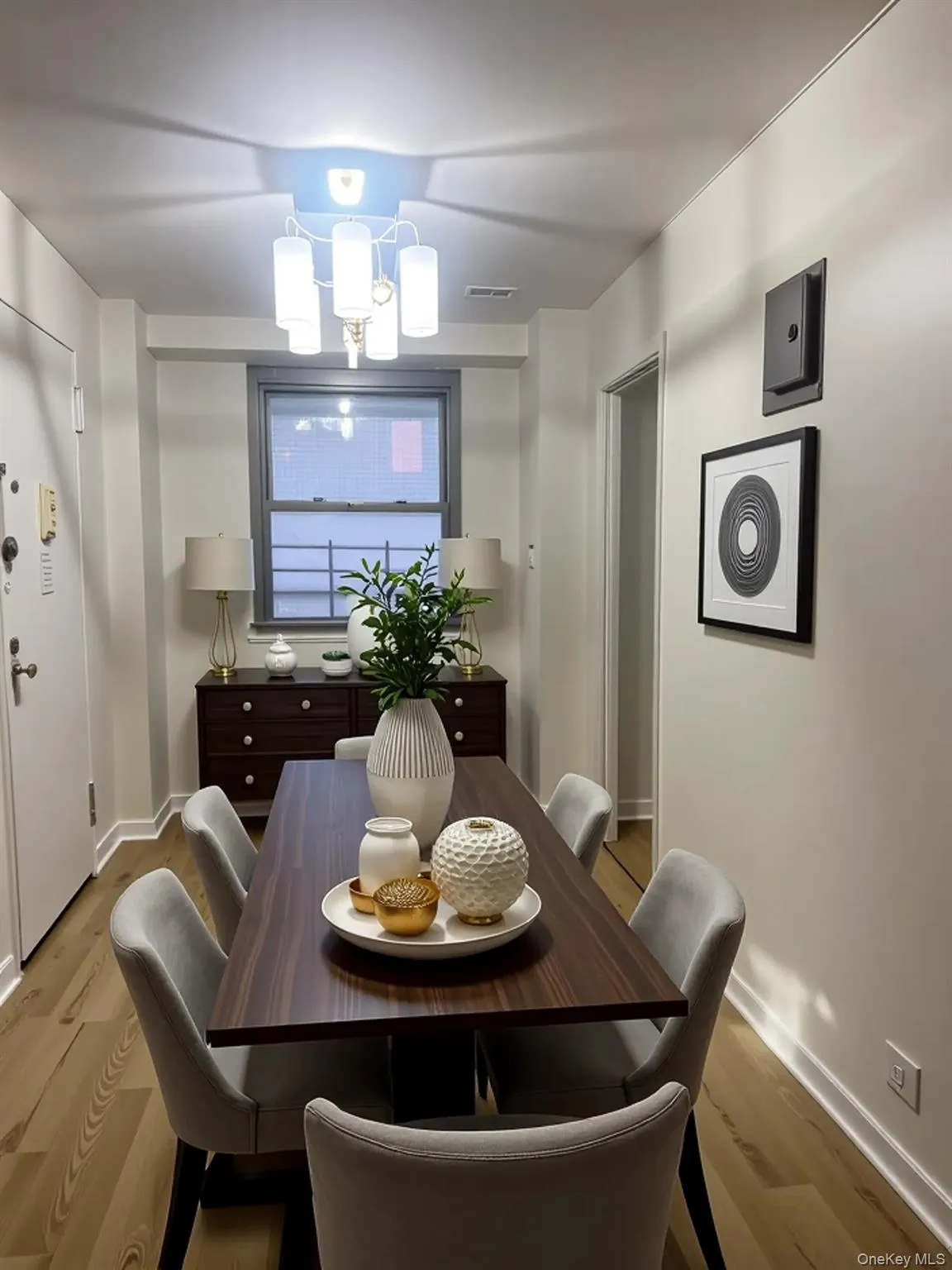 Dining area with baseboards and light wood-style flooring Dining area with baseboards and light wood-style flooring