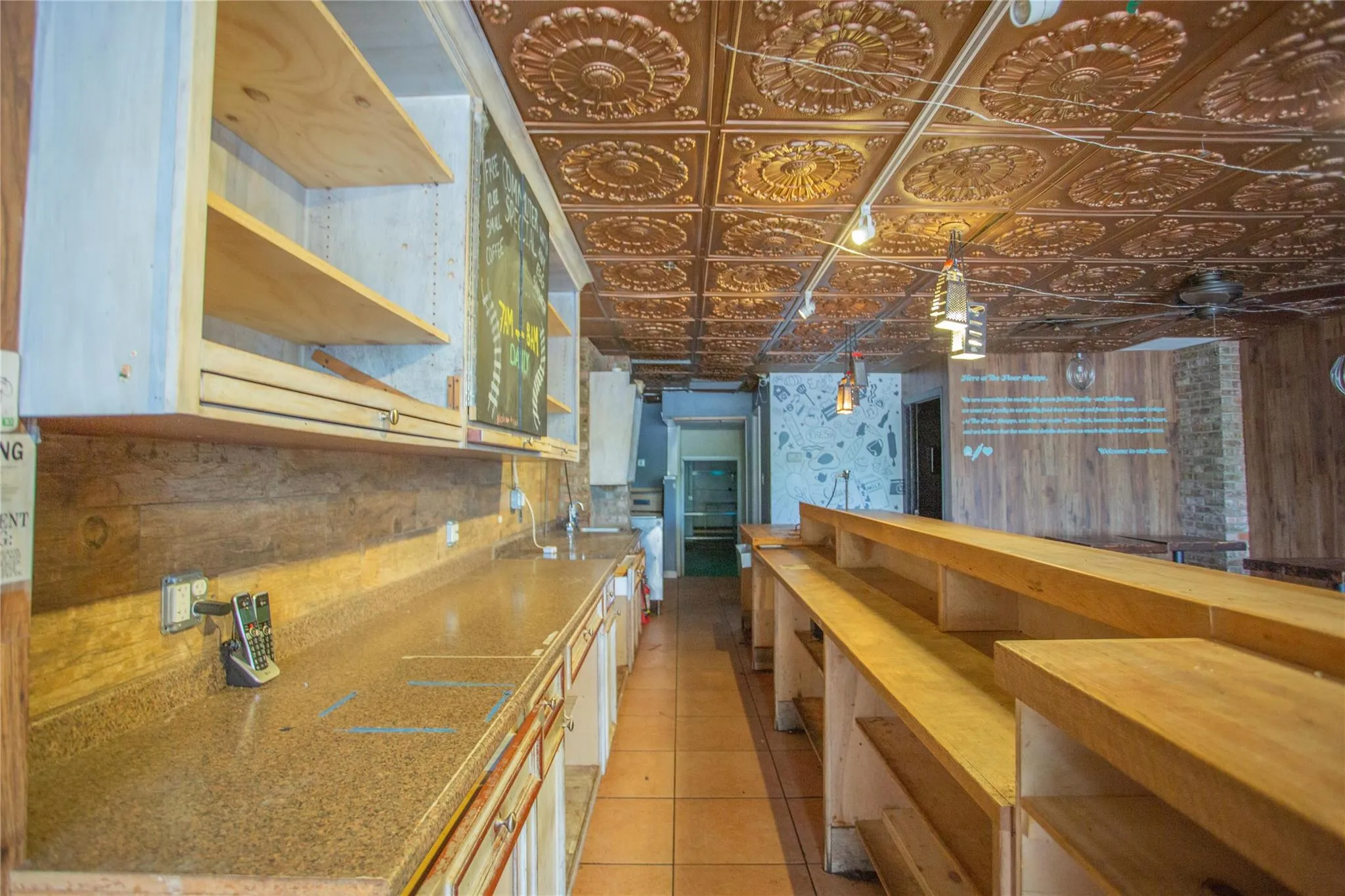 Kitchen featuring an ornate ceiling and light tile patterned floors Kitchen featuring an ornate ceiling and light tile patterned floors