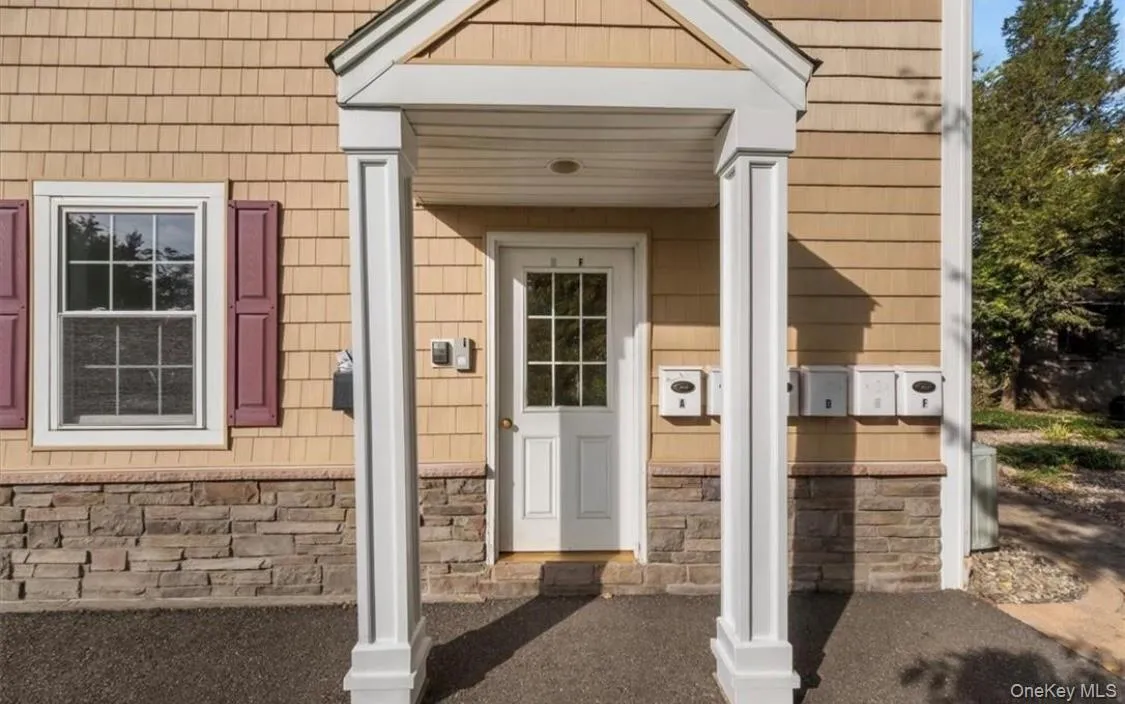 Entrance to property featuring stone siding Entrance to property featuring stone siding