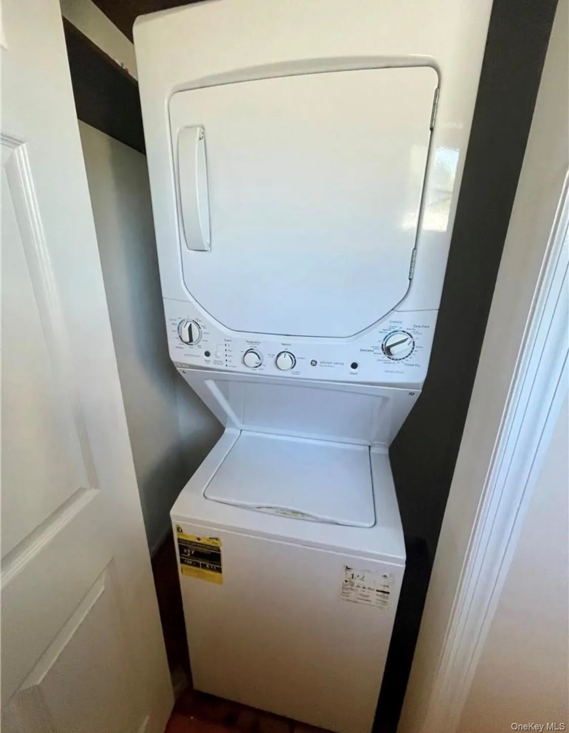 Washroom featuring stacked washer and clothes dryer Washroom featuring stacked washer and clothes dryer