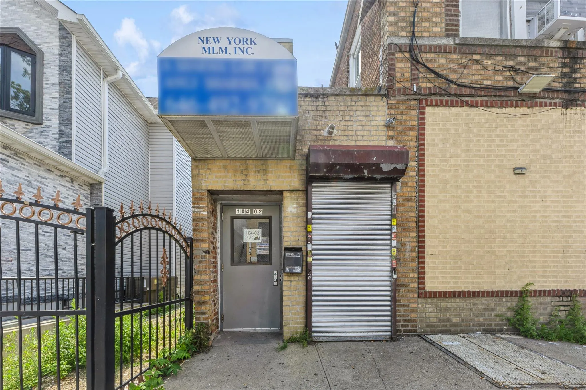 Property entrance with brick siding and a gate Property entrance with brick siding and a gate