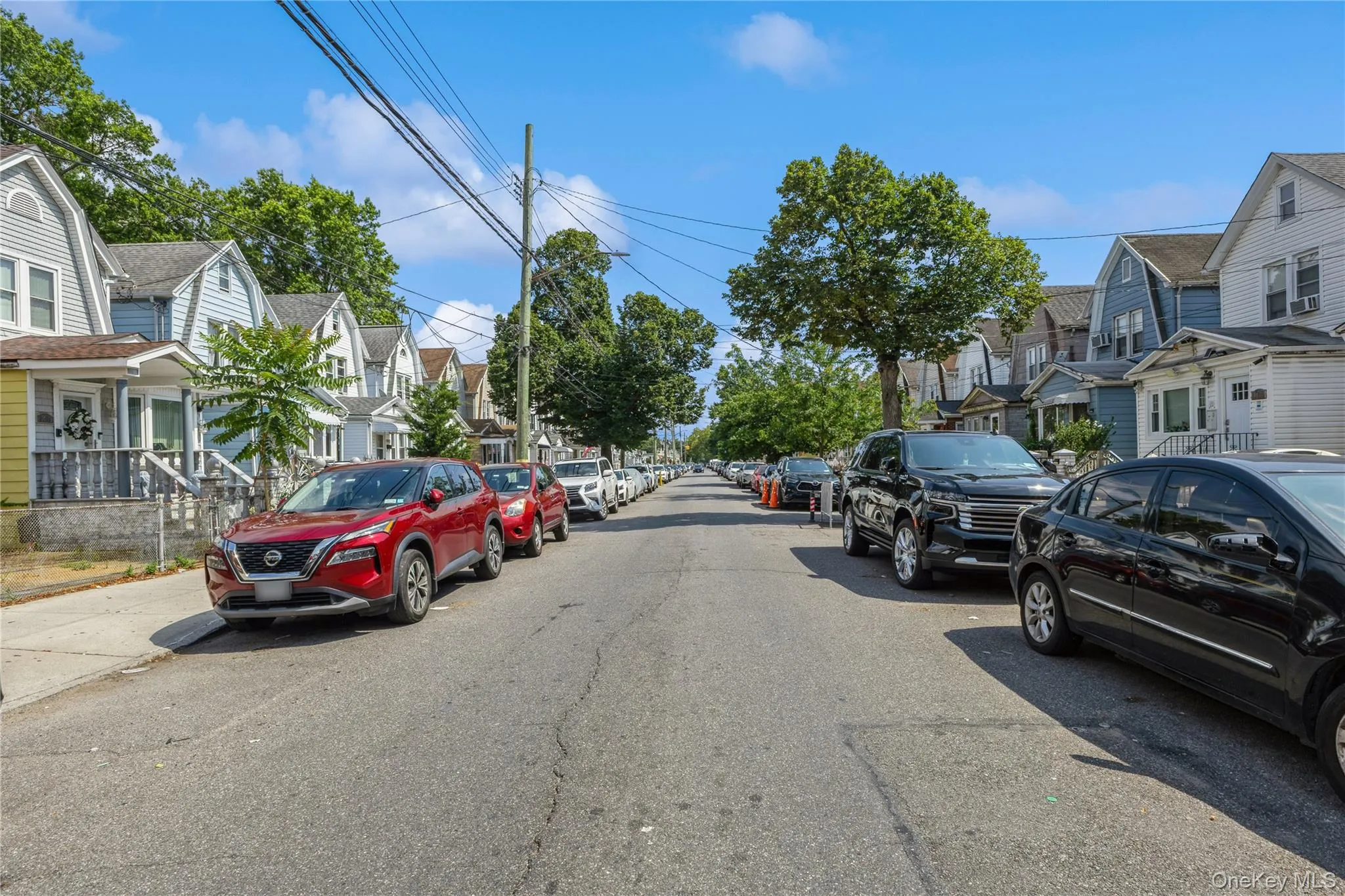 View of asphalt road featuring a residential view View of asphalt road featuring a residential view