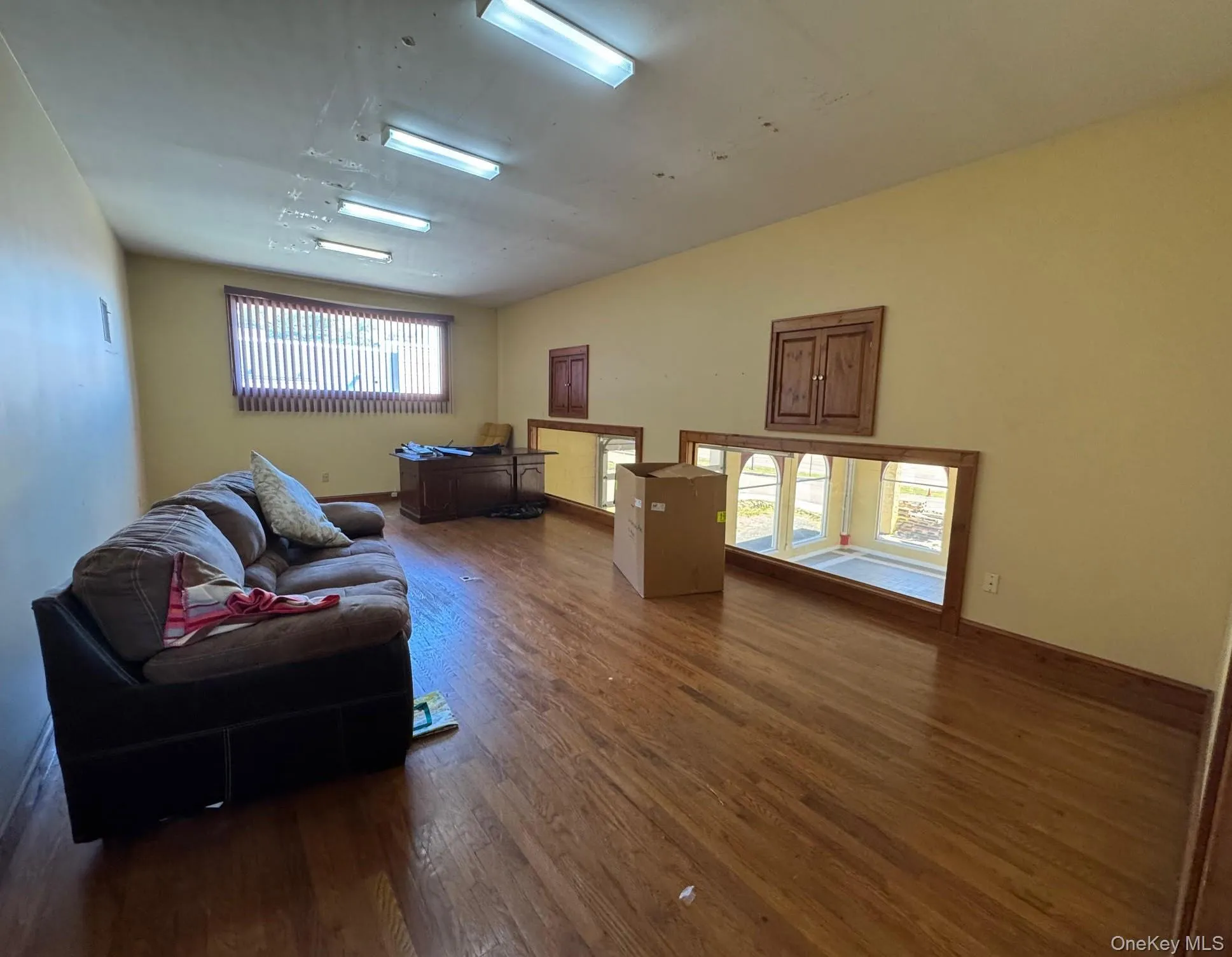 Living room with wood finished floors and baseboards Living room with wood finished floors and baseboards
