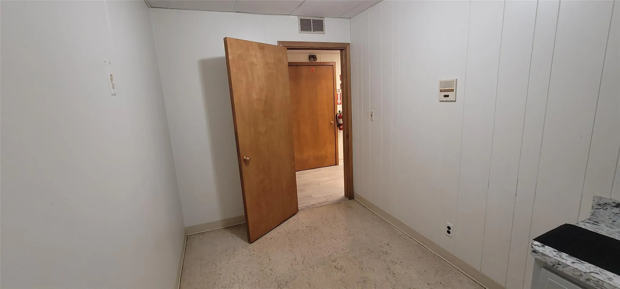 Corridor featuring baseboards Corridor featuring baseboards