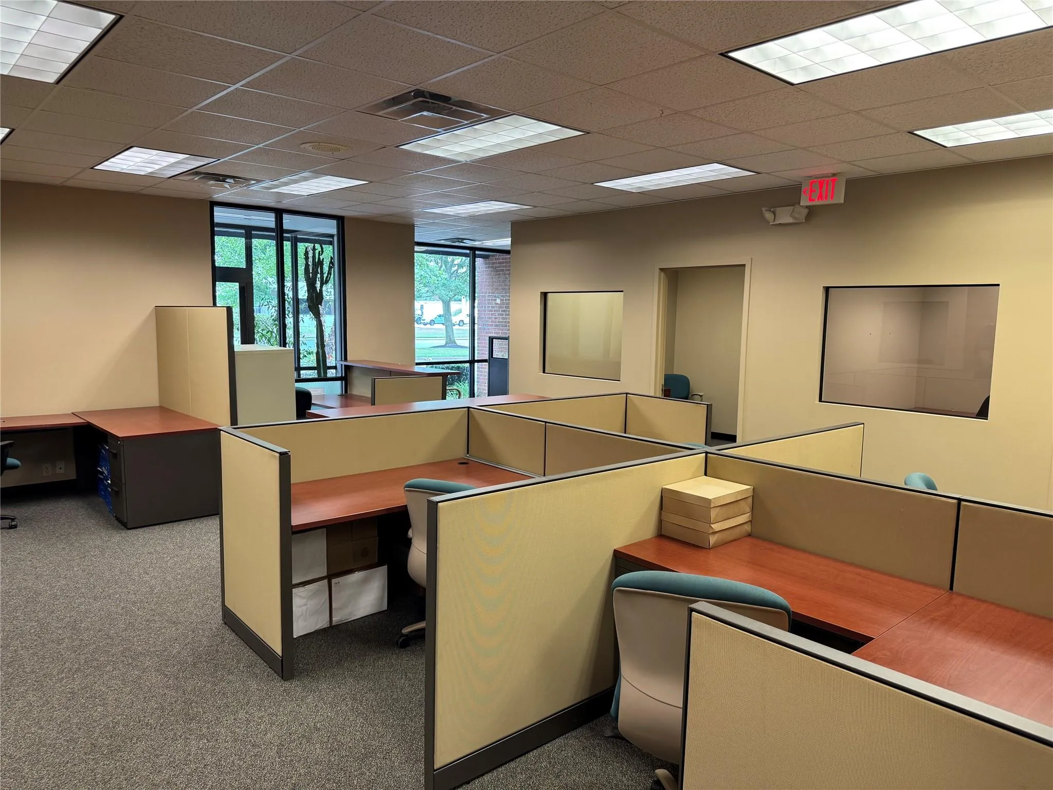 Office area with carpet flooring and a paneled ceiling Office area with carpet flooring and a paneled ceiling
