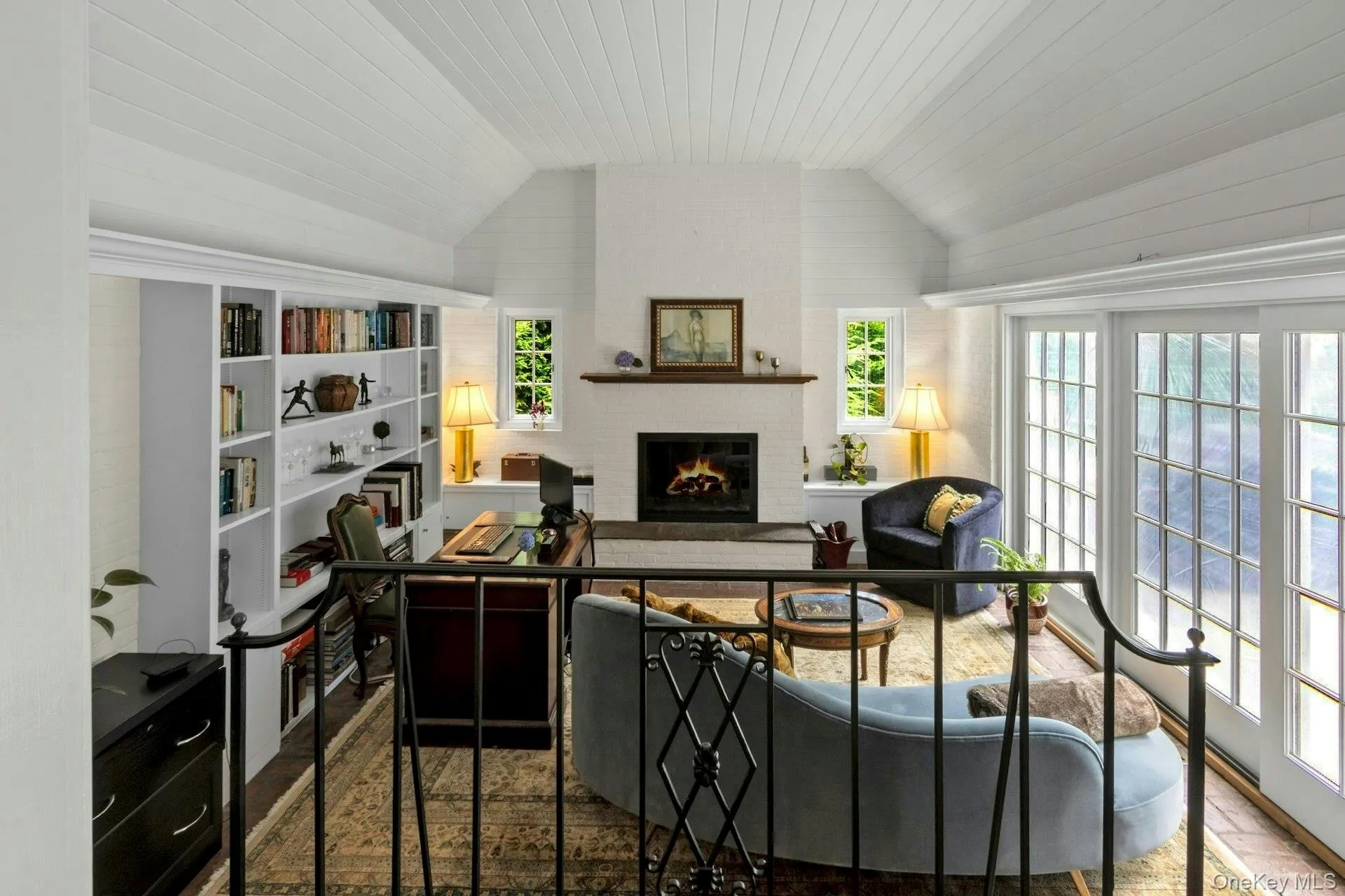 Living room with a fireplace and vaulted ceiling Living room with a fireplace and vaulted ceiling