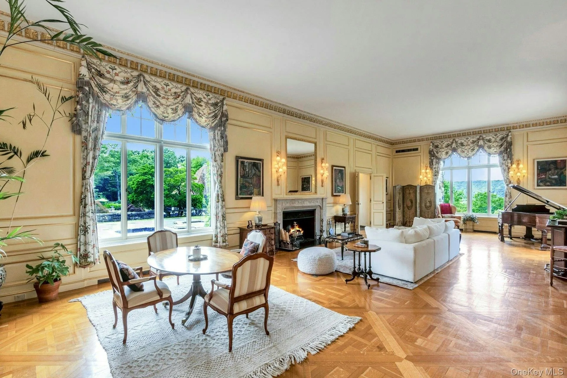 Dining room featuring a decorative wall and a warm lit fireplace Dining room featuring a decorative wall and a warm lit fireplace