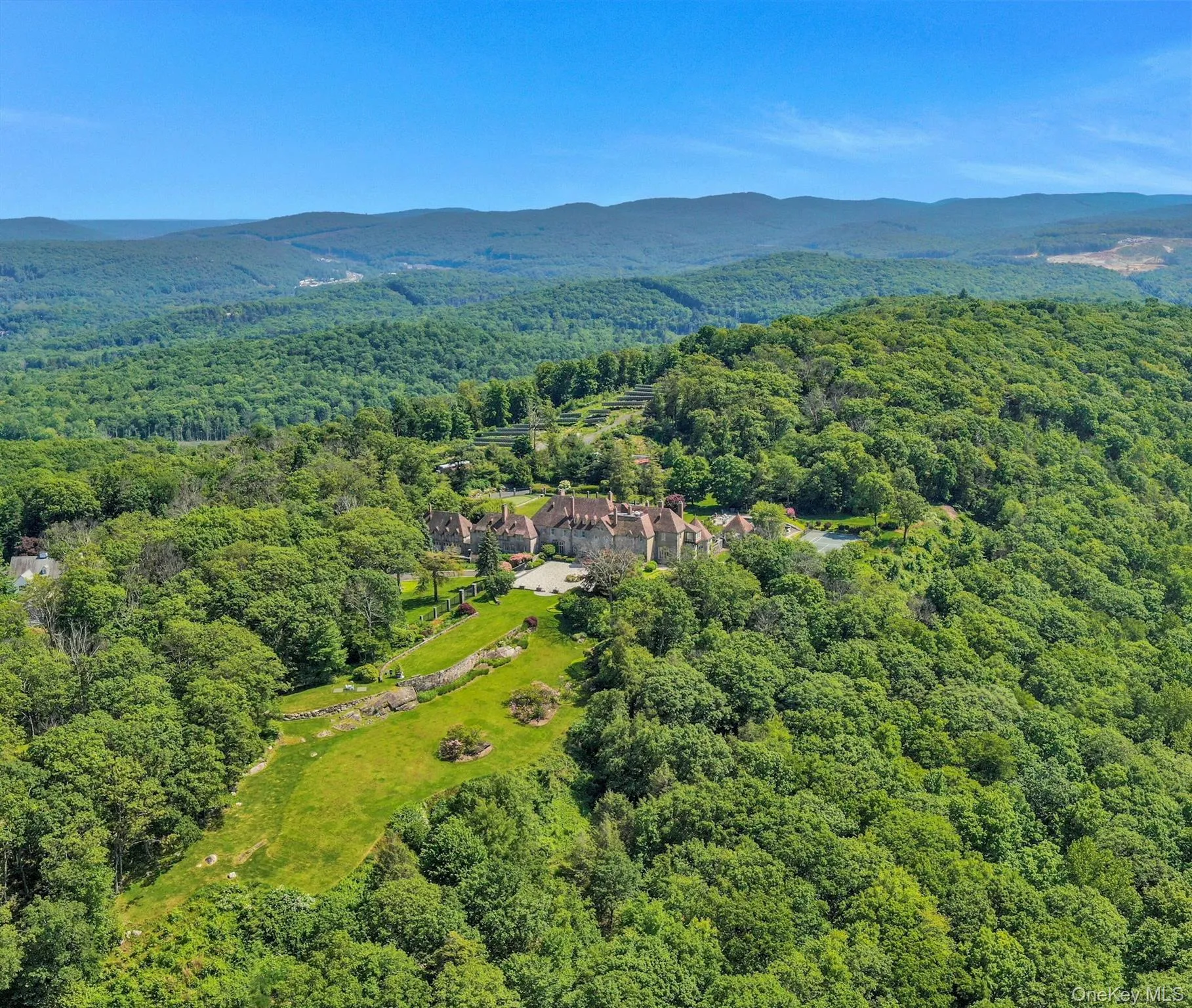 Bird's eye view of a forest and a mountainous background Bird's eye view of a forest and a mountainous background
