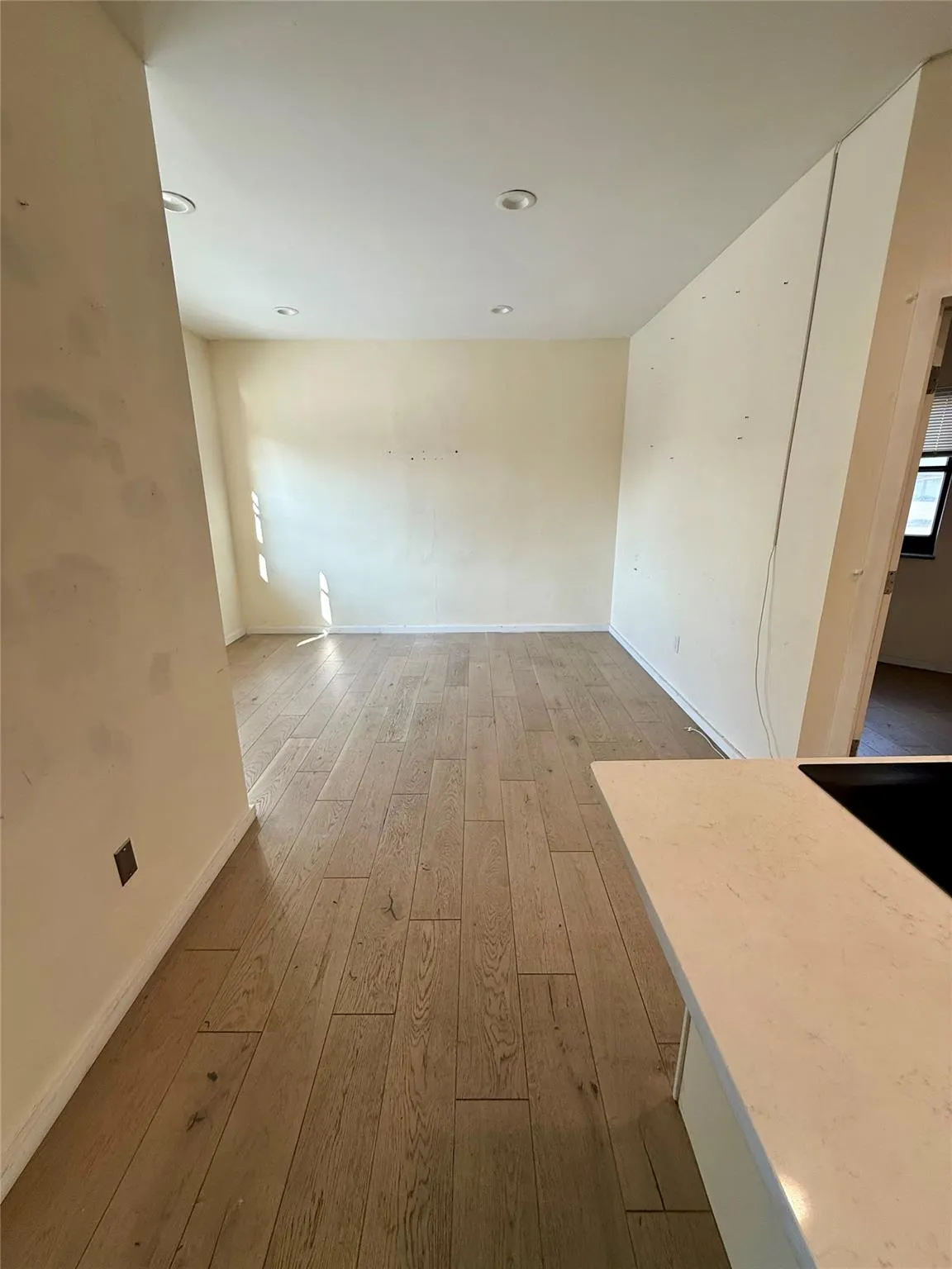Spare room with hardwood / wood-style flooring and recessed lighting Spare room with hardwood / wood-style flooring and recessed lighting