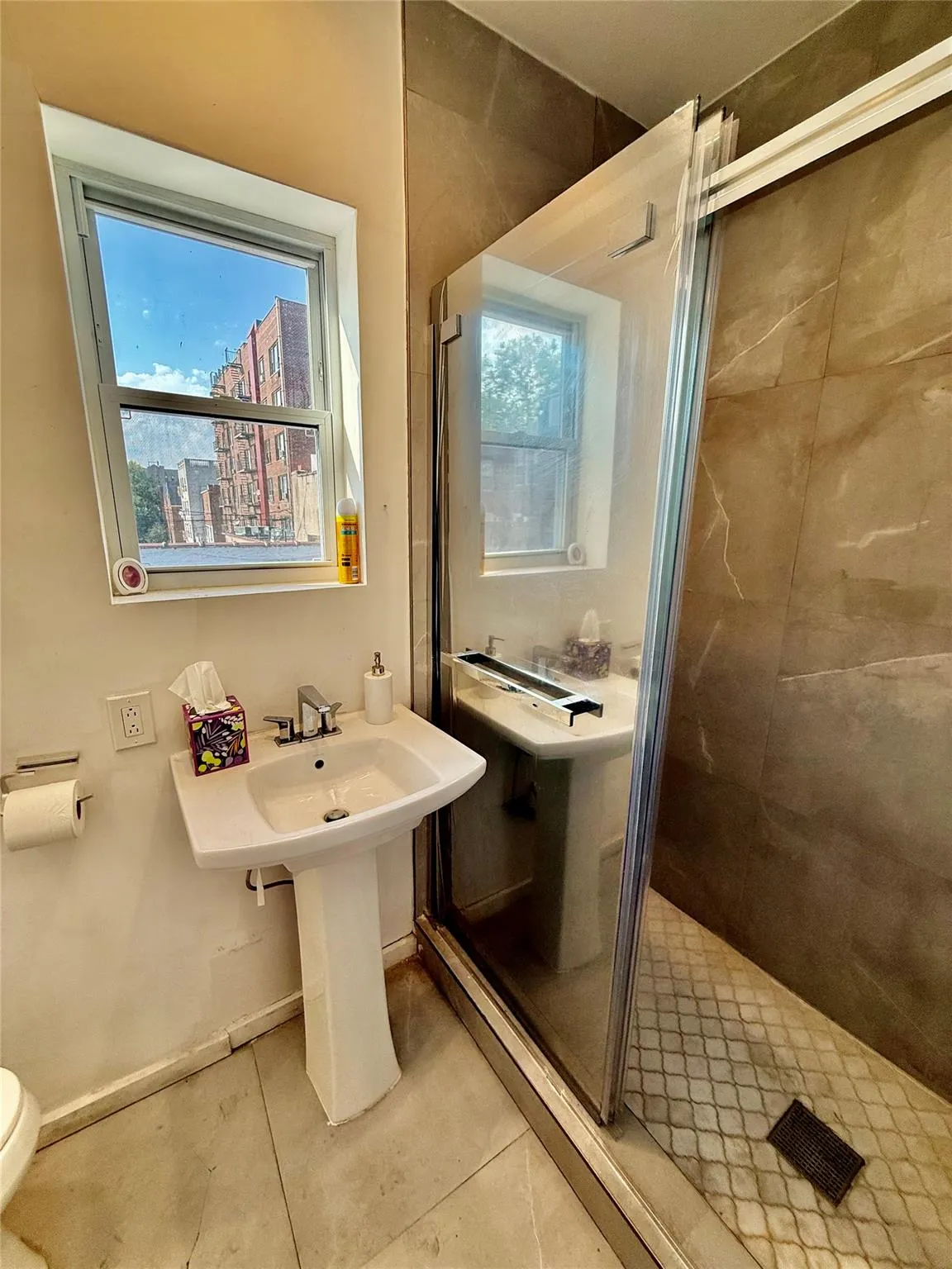 Full bathroom with tile patterned floors and a stall shower Full bathroom with tile patterned floors and a stall shower