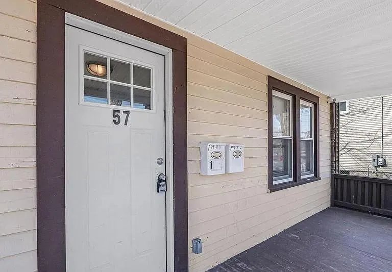 View of exterior entry with a porch View of exterior entry with a porch
