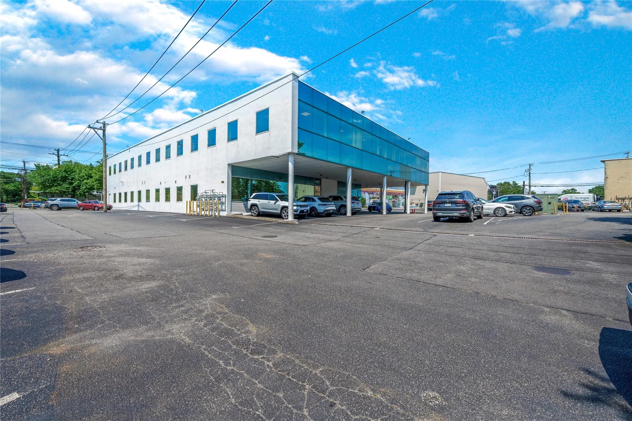 View of commercial location featuring uncovered parking View of commercial location featuring uncovered parking