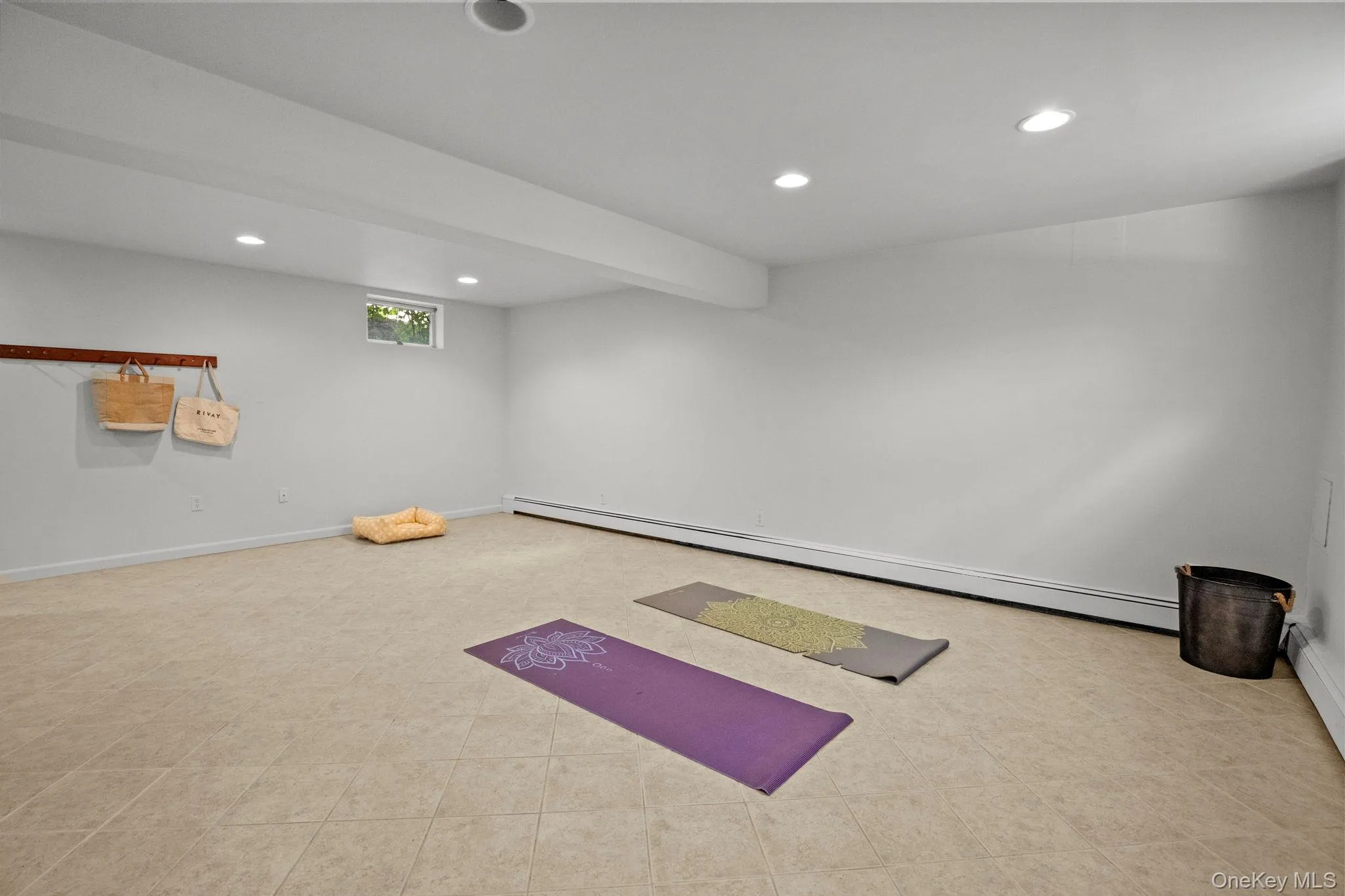 Exercise area with recessed lighting and a baseboard heating unit Exercise area with recessed lighting and a baseboard heating unit