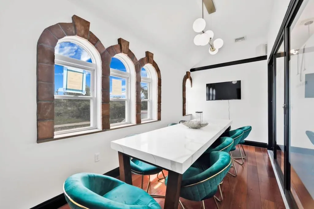 Conference room featuring vaulted ceiling and dark wood finished floors Conference room featuring vaulted ceiling and dark wood finished floors