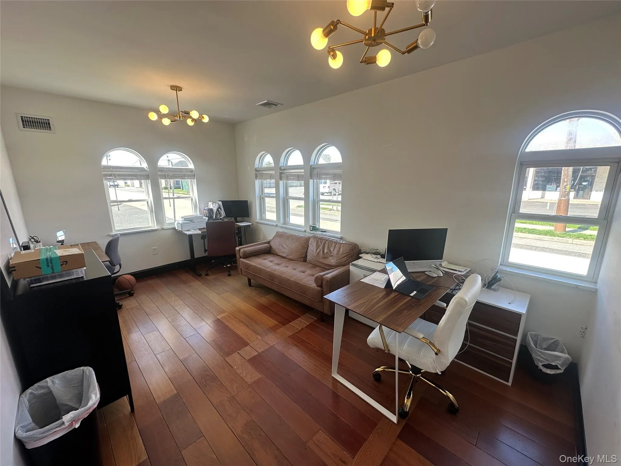 Office featuring a chandelier and hardwood / wood-style floors Office featuring a chandelier and hardwood / wood-style floors