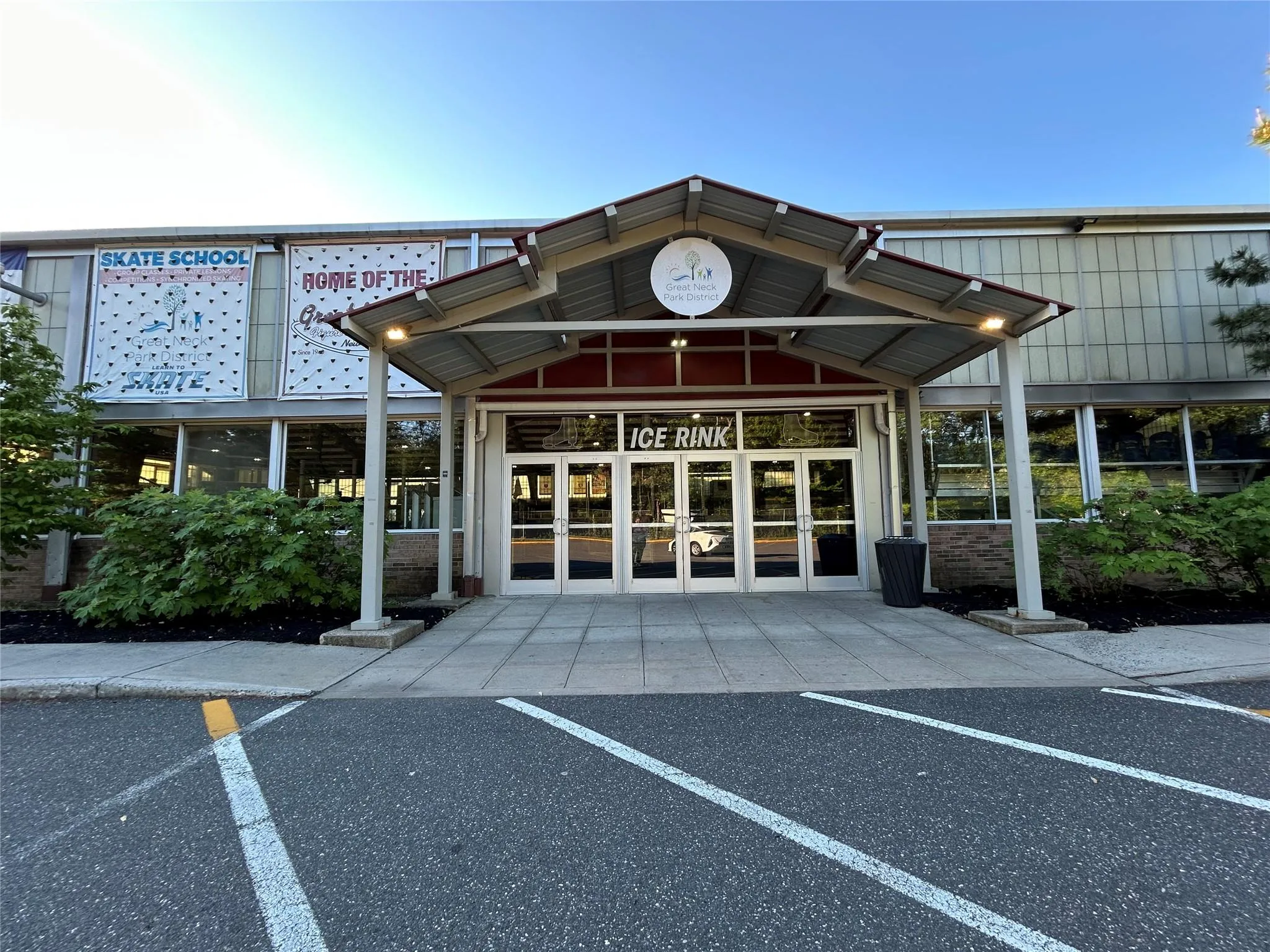 View of building exterior featuring uncovered parking View of building exterior featuring uncovered parking