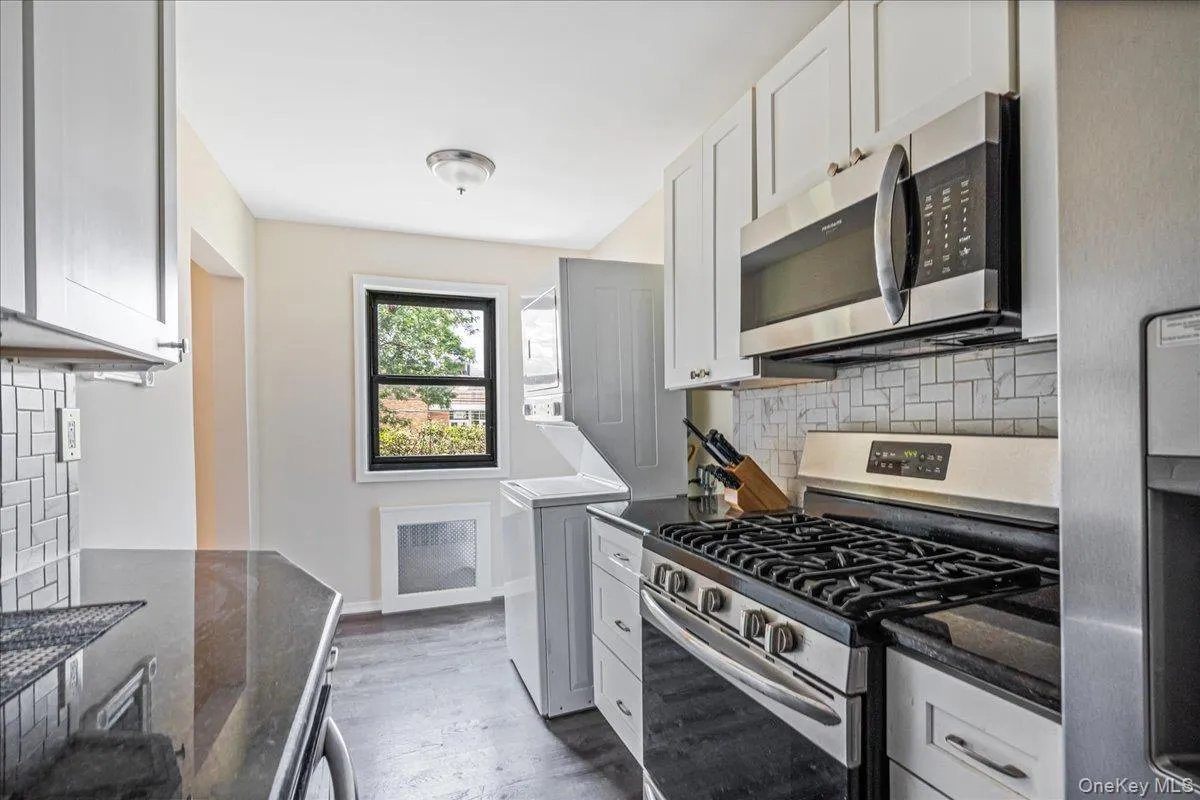 Kitchen with appliances with stainless steel finishes Kitchen with appliances with stainless steel finishes