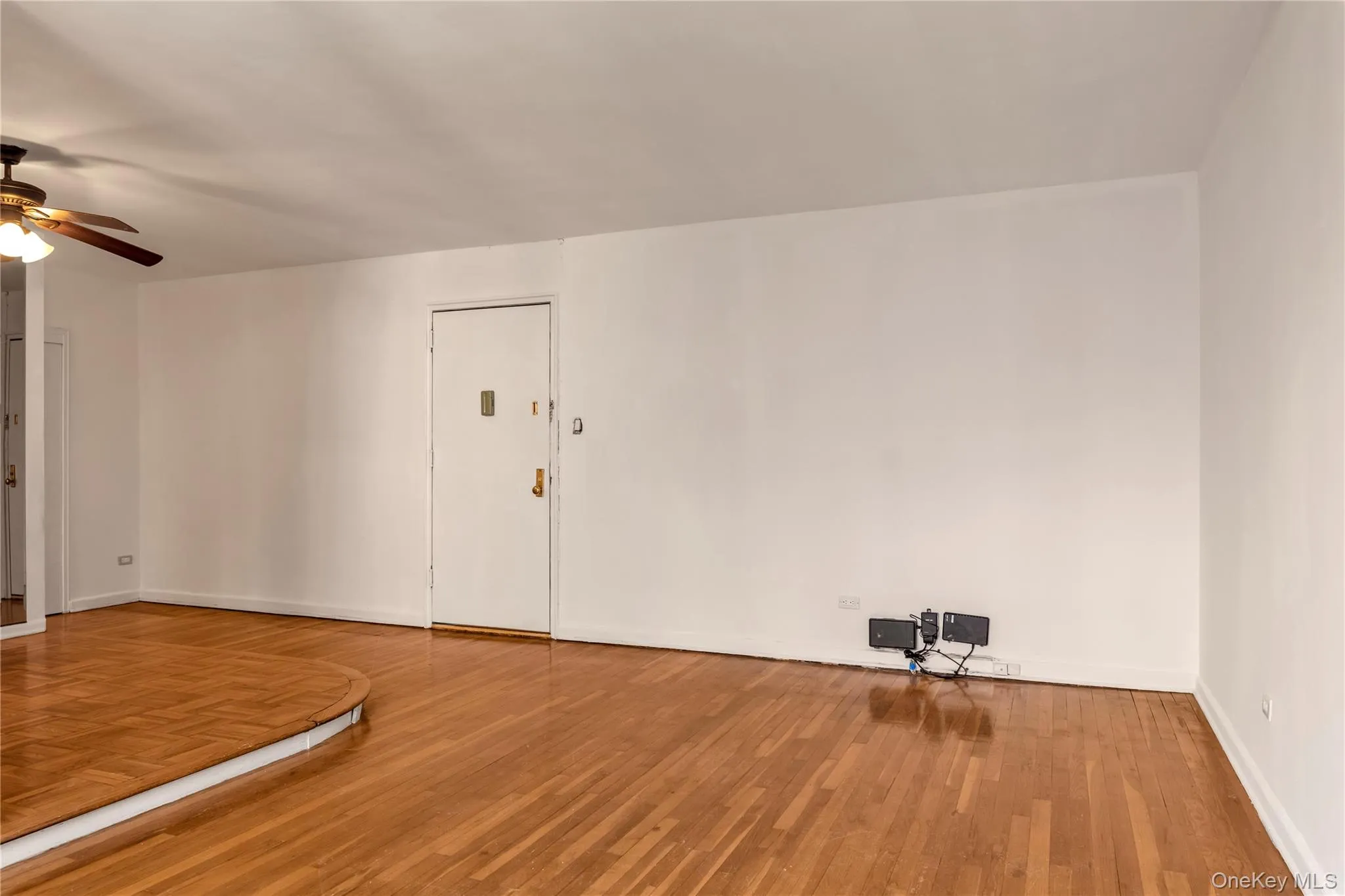 Empty room featuring ceiling fan and wood finished floors Empty room featuring ceiling fan and wood finished floors
