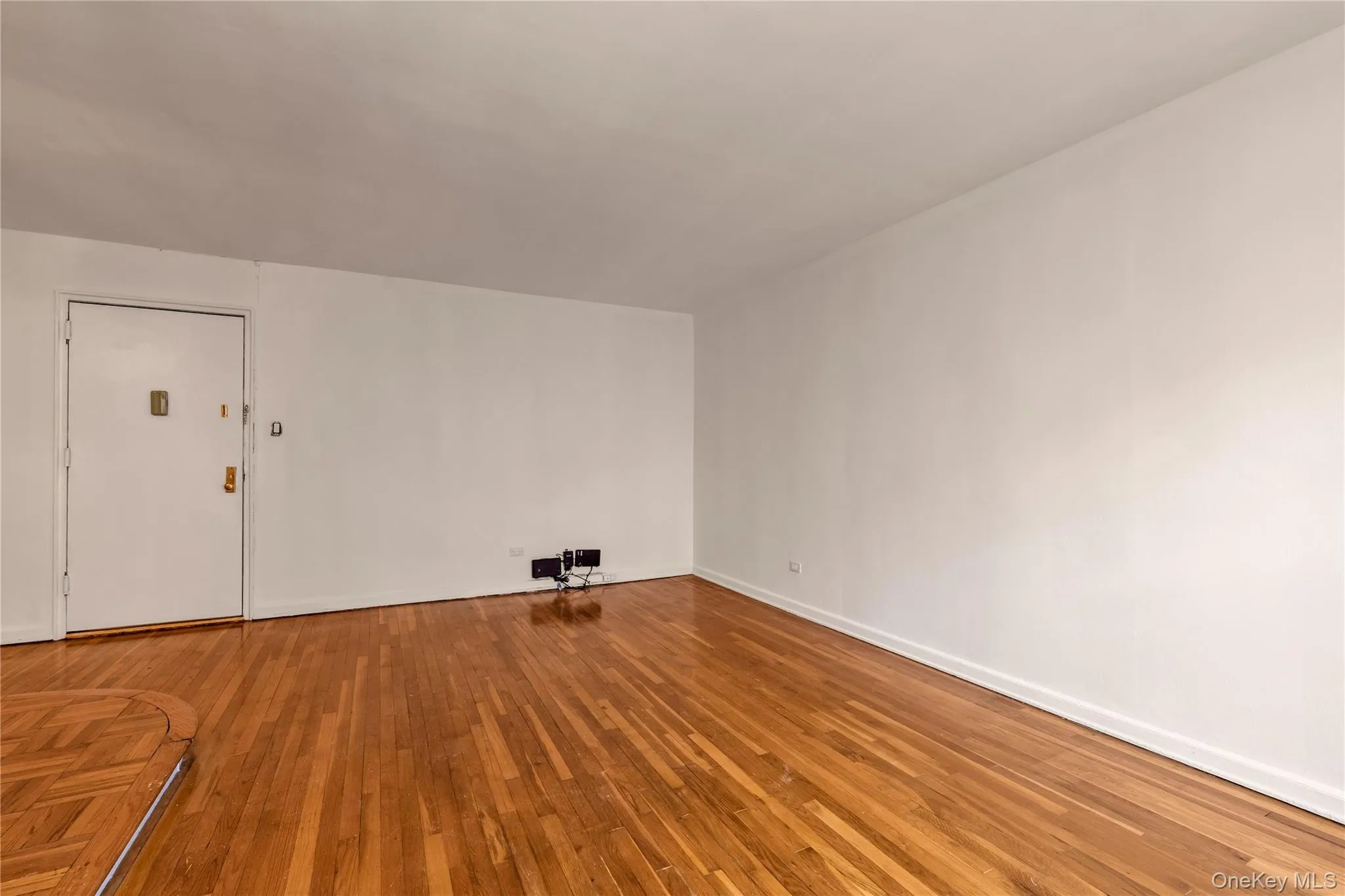 Empty room featuring hardwood / wood-style flooring Empty room featuring hardwood / wood-style flooring