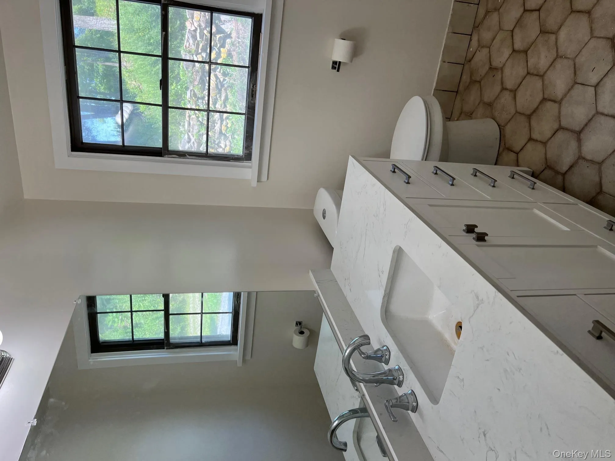 Half bathroom with toilet and vanity Half bathroom with toilet and vanity