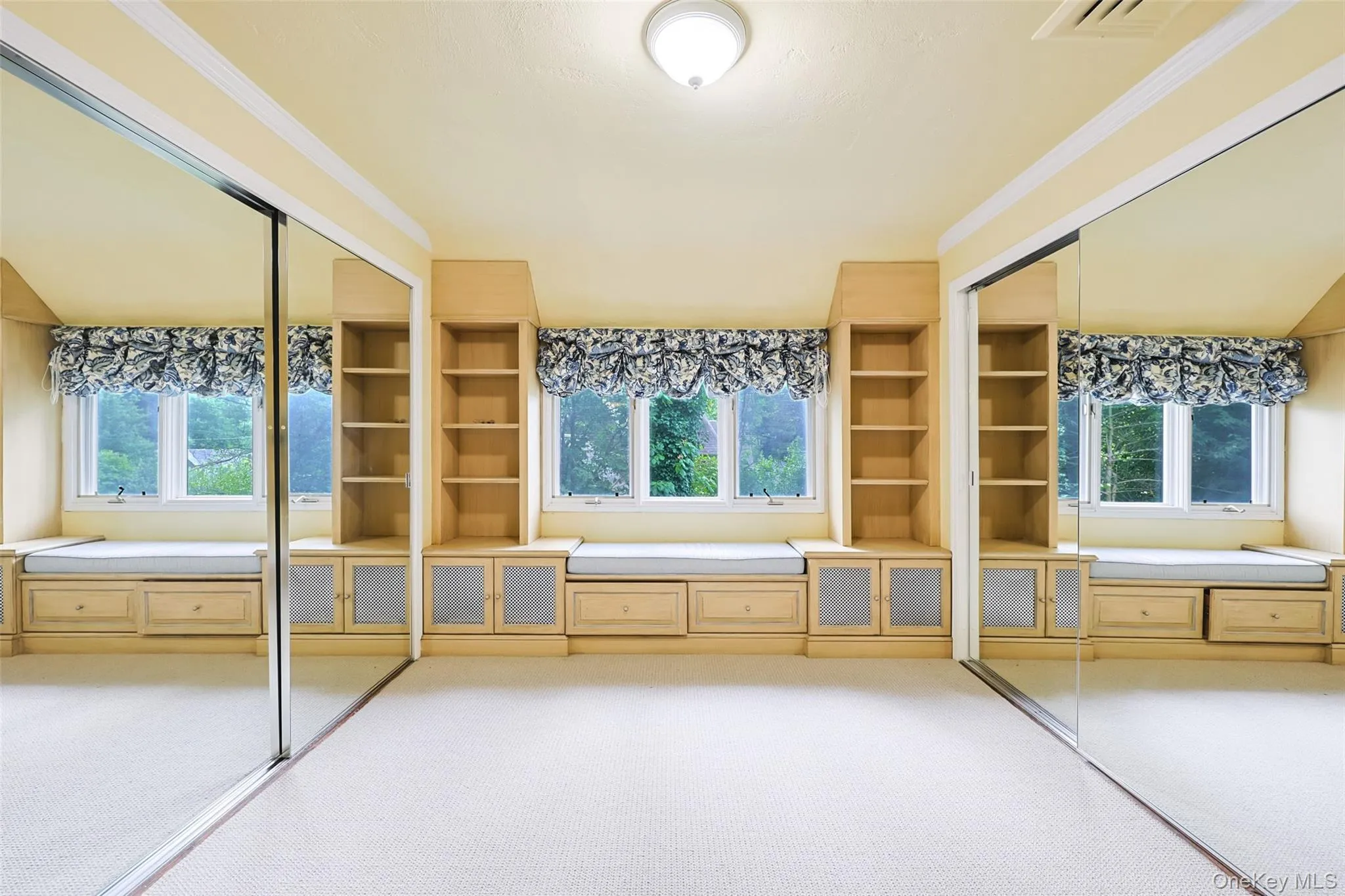 Unfurnished bedroom featuring a closet, carpet floors, and ornamental molding Unfurnished bedroom featuring a closet, carpet floors, and ornamental molding